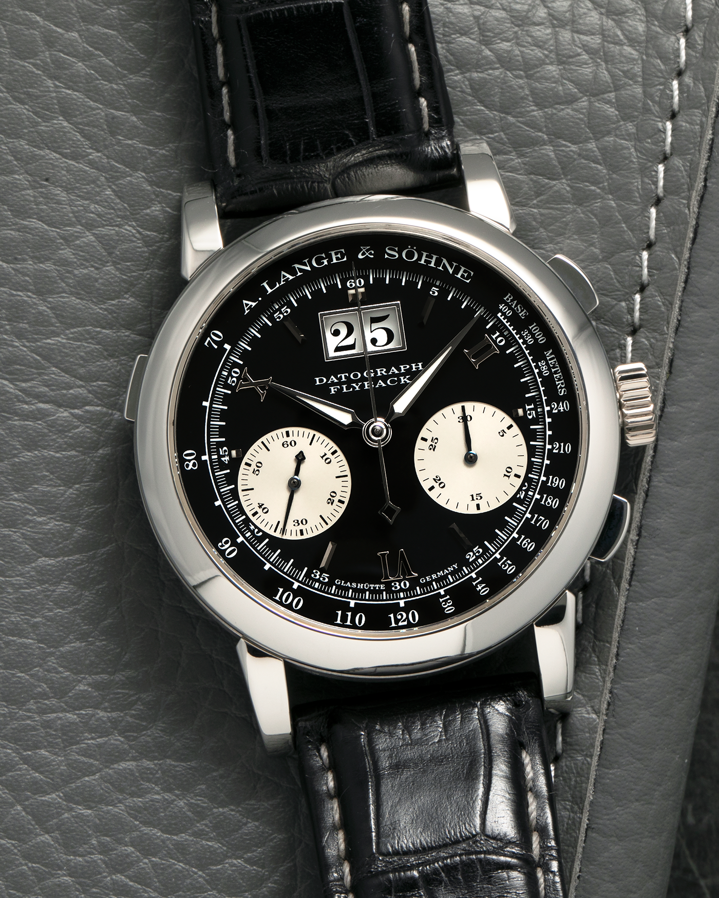 Brand: A. Lange & Söhne
Year: 2007
Model: Datograph
Reference Number: 403.035
Material: Platinum 950
Movement: A. Lange & Söhne Cal. L951.1, Manual-Winding
Case Diameter: 39mm x 13mm (Lug-to-Lug 48mm)
Lug Width: 20mm
Strap: A. Lange & Söhne Black Alligator Leather Strap with Signed Platinum 950 Deployant Clasp