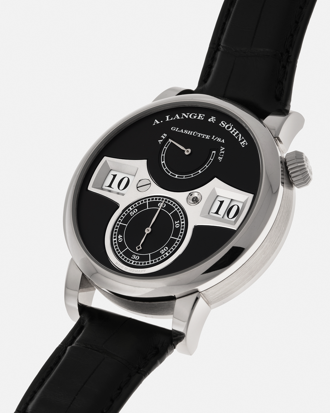 Brand: A. Lange & Söhne
Year: 2014
Model: Zeitwerk
Reference Number: 140.029
Material: 18-carat White Gold
Movement: A. Lange & Söhne Cal. L043.1, Manual-Winding
Case Dimensions: 41.9mm x 12.9mm (49.9mm Lug-to-Lug)
Lug Width: 20mm
Strap: A. Lange & Söhne Black Alligator Strap with Signed 18-carat White Gold Tang Buckle