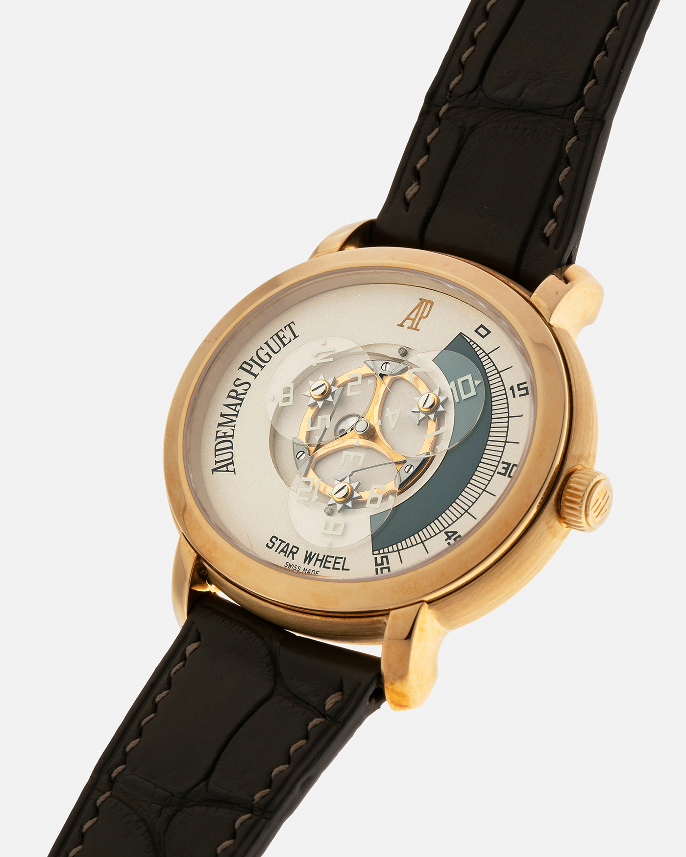 Brand: Audemars Piguet Year: 2000 Model: Millenary ‘Star Wheel’, Limited to 50 Pieces in 18-carat Yellow Gold  Reference Number: 25898BA Material: 18-carat Yellow Gold  Movement: Audemars Piguet Cal. 2224, Self-Winding Case Diameter: 41mm Lug Width: 20mm Bracelet: Olive Green Alligator Leather Strap with Signed 18-carat Yellow Gold Tang Buckle