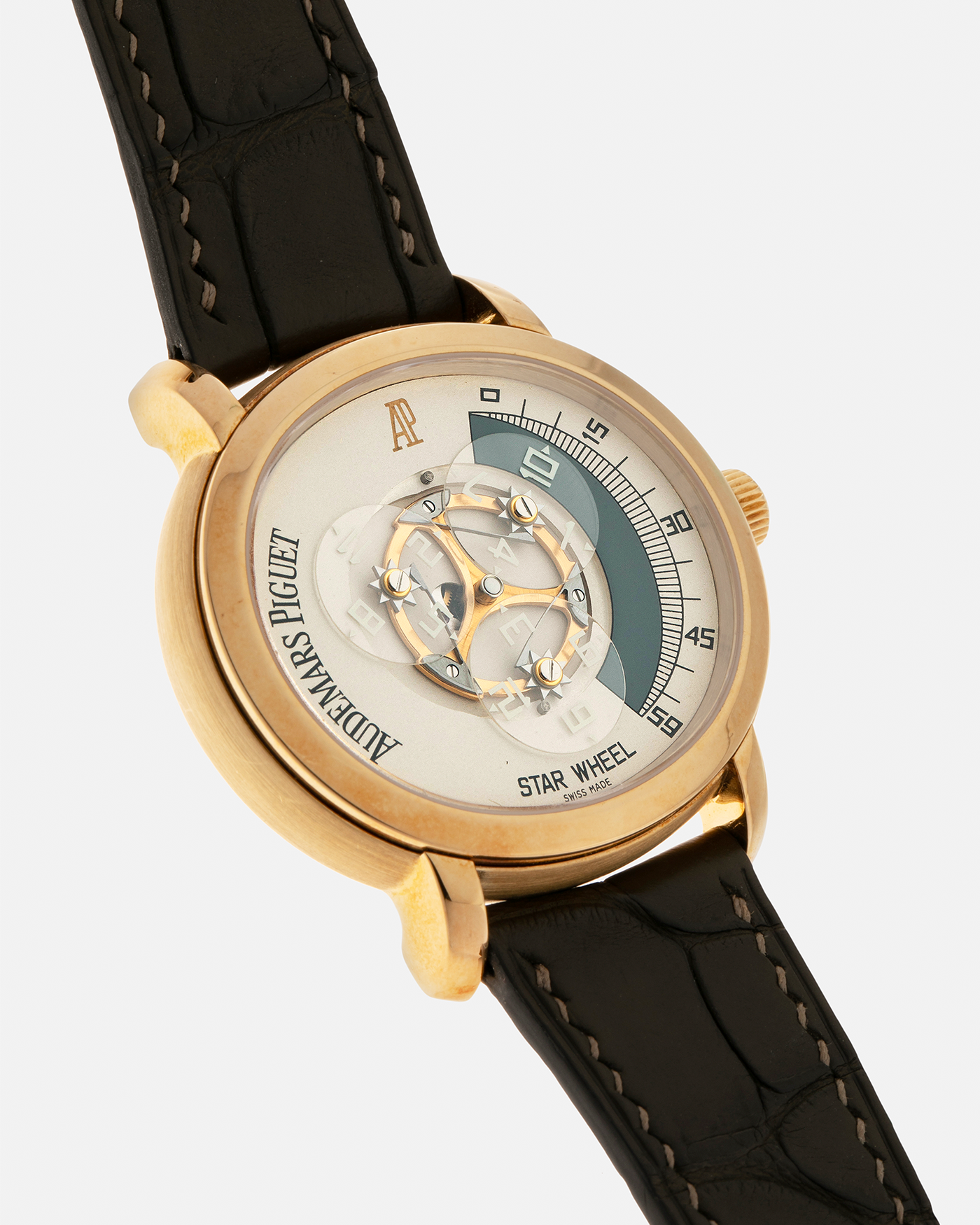 Brand: Audemars Piguet Year: 2000 Model: Millenary ‘Star Wheel’, Limited to 50 Pieces in 18-carat Yellow Gold  Reference Number: 25898BA Material: 18-carat Yellow Gold  Movement: Audemars Piguet Cal. 2224, Self-Winding Case Diameter: 41mm Lug Width: 20mm Bracelet: Olive Green Alligator Leather Strap with Signed 18-carat Yellow Gold Tang Buckle