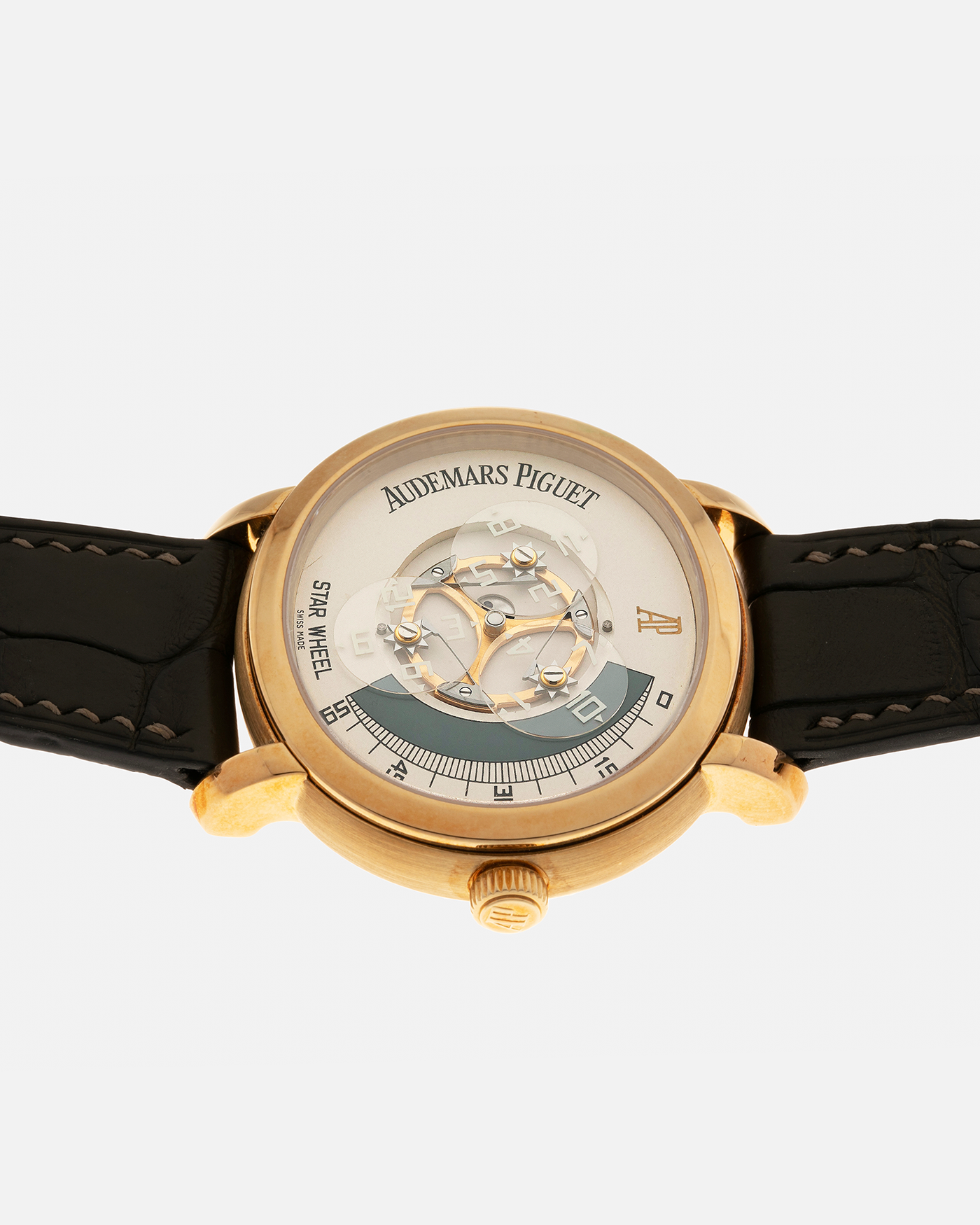 Brand: Audemars Piguet Year: 2000 Model: Millenary ‘Star Wheel’, Limited to 50 Pieces in 18-carat Yellow Gold  Reference Number: 25898BA Material: 18-carat Yellow Gold  Movement: Audemars Piguet Cal. 2224, Self-Winding Case Diameter: 41mm Lug Width: 20mm Bracelet: Olive Green Alligator Leather Strap with Signed 18-carat Yellow Gold Tang Buckle