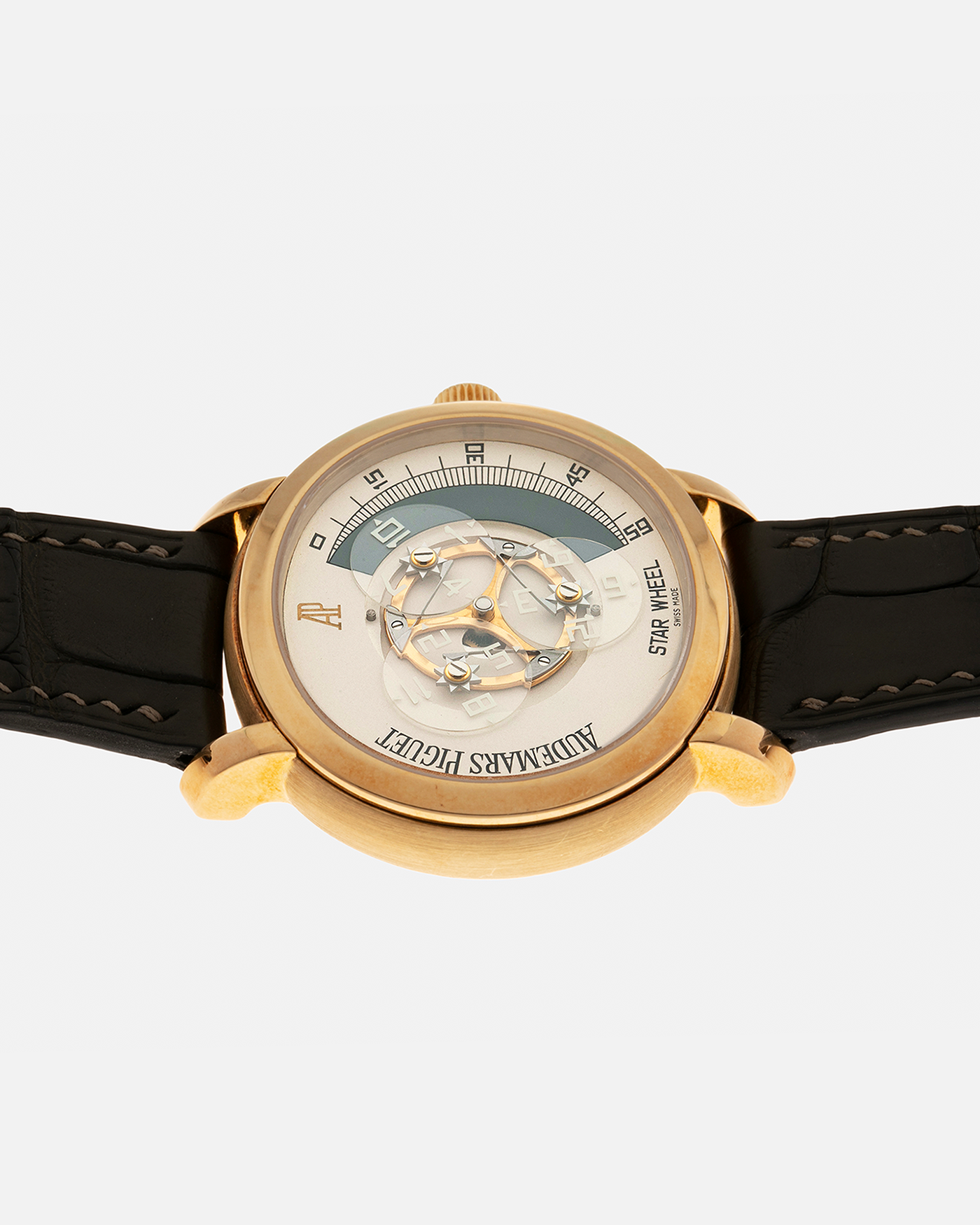 Brand: Audemars Piguet Year: 2000 Model: Millenary ‘Star Wheel’, Limited to 50 Pieces in 18-carat Yellow Gold  Reference Number: 25898BA Material: 18-carat Yellow Gold  Movement: Audemars Piguet Cal. 2224, Self-Winding Case Diameter: 41mm Lug Width: 20mm Bracelet: Olive Green Alligator Leather Strap with Signed 18-carat Yellow Gold Tang Buckle