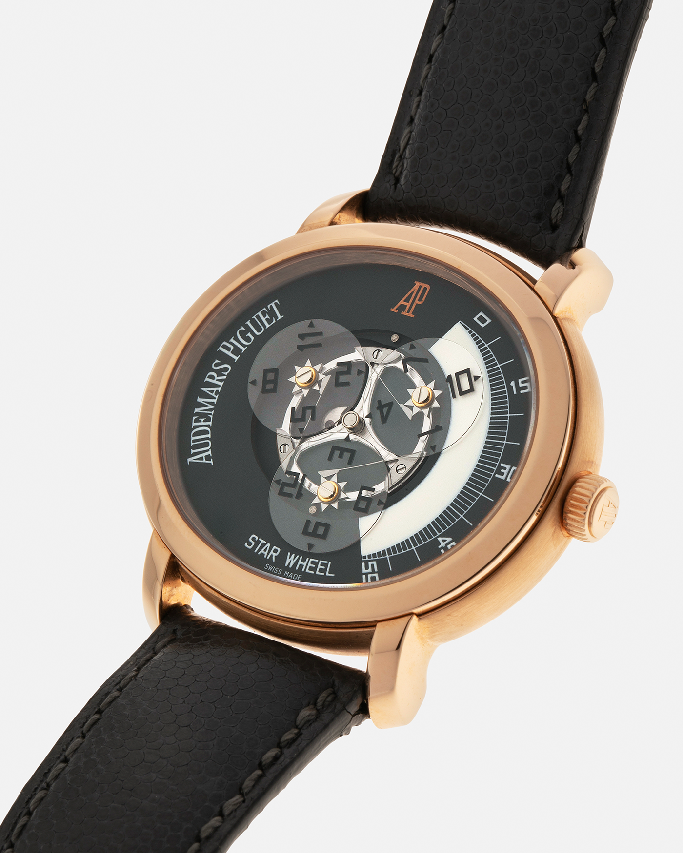 Brand: Audemars Piguet Year: 2000 Model: Millenary ‘Star Wheel’, Limited to 75 Pieces in 18-carat Rose Gold  Reference Number: 25898OR Material: 18-carat Rose Gold  Movement: Audemars Piguet Cal. 2224, Self-Winding Case Diameter: 41mm Lug Width: 20mm Bracelet: Audemars Piguet Dark Grey Grained Calf Leather Strap with Signed 18-carat Rose Gold ‘AP’ Deployant Buckle