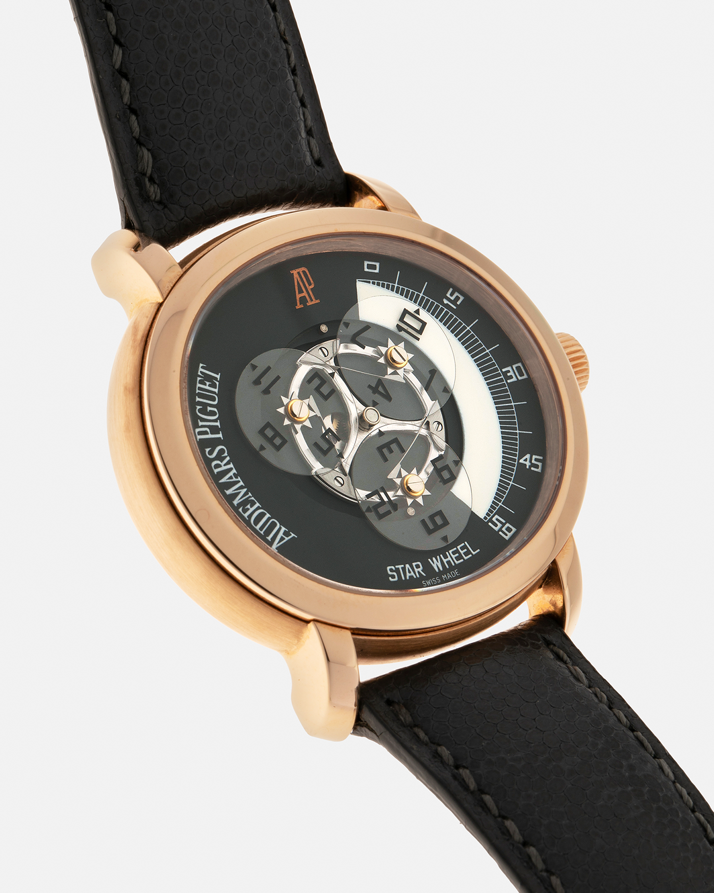 Brand: Audemars Piguet Year: 2000 Model: Millenary ‘Star Wheel’, Limited to 75 Pieces in 18-carat Rose Gold  Reference Number: 25898OR Material: 18-carat Rose Gold  Movement: Audemars Piguet Cal. 2224, Self-Winding Case Diameter: 41mm Lug Width: 20mm Bracelet: Audemars Piguet Dark Grey Grained Calf Leather Strap with Signed 18-carat Rose Gold ‘AP’ Deployant Buckle