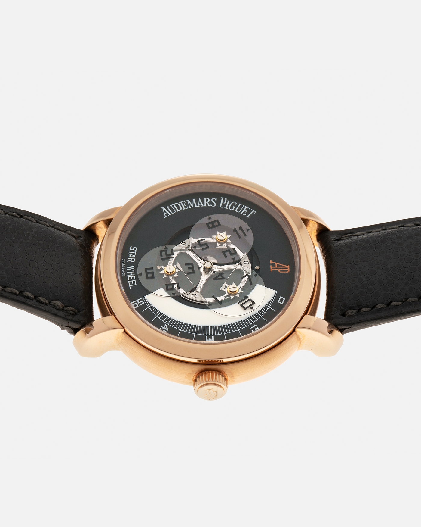 Brand: Audemars Piguet Year: 2000 Model: Millenary ‘Star Wheel’, Limited to 75 Pieces in 18-carat Rose Gold  Reference Number: 25898OR Material: 18-carat Rose Gold  Movement: Audemars Piguet Cal. 2224, Self-Winding Case Diameter: 41mm Lug Width: 20mm Bracelet: Audemars Piguet Dark Grey Grained Calf Leather Strap with Signed 18-carat Rose Gold ‘AP’ Deployant Buckle