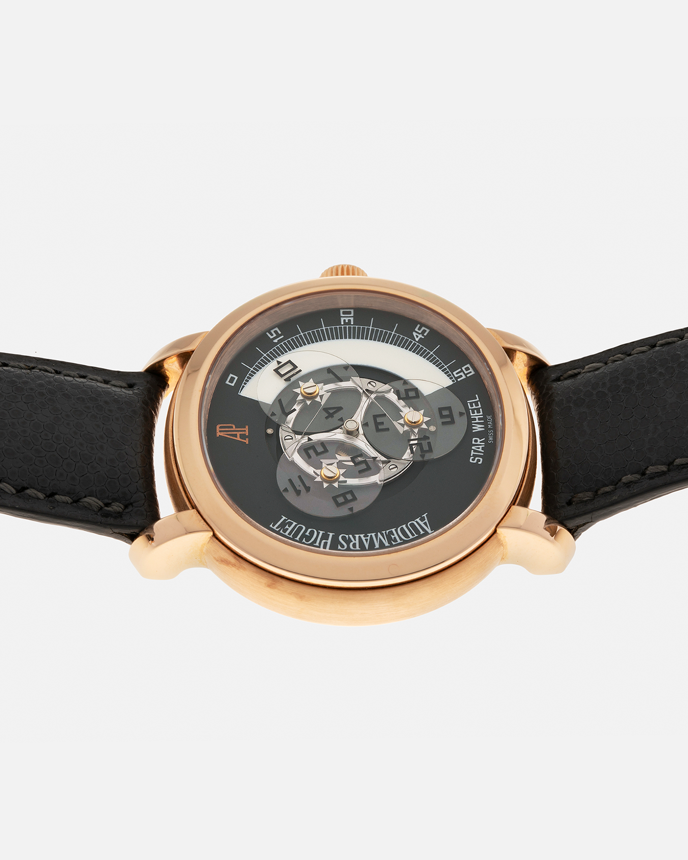 Brand: Audemars Piguet Year: 2000 Model: Millenary ‘Star Wheel’, Limited to 75 Pieces in 18-carat Rose Gold  Reference Number: 25898OR Material: 18-carat Rose Gold  Movement: Audemars Piguet Cal. 2224, Self-Winding Case Diameter: 41mm Lug Width: 20mm Bracelet: Audemars Piguet Dark Grey Grained Calf Leather Strap with Signed 18-carat Rose Gold ‘AP’ Deployant Buckle