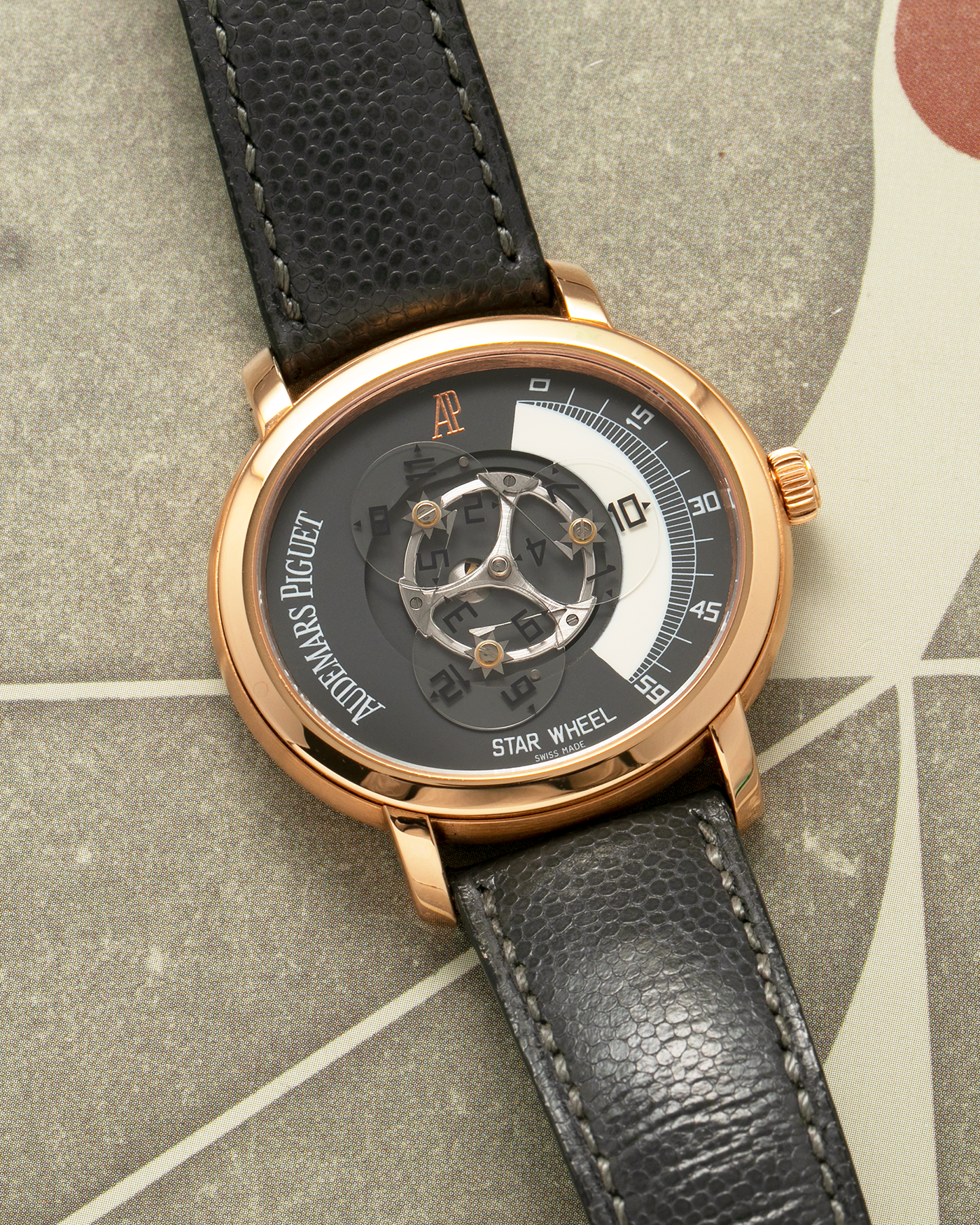 Brand: Audemars Piguet Year: 2000 Model: Millenary ‘Star Wheel’, Limited to 75 Pieces in 18-carat Rose Gold  Reference Number: 25898OR Material: 18-carat Rose Gold  Movement: Audemars Piguet Cal. 2224, Self-Winding Case Diameter: 41mm Lug Width: 20mm Bracelet: Audemars Piguet Dark Grey Grained Calf Leather Strap with Signed 18-carat Rose Gold ‘AP’ Deployant Buckle