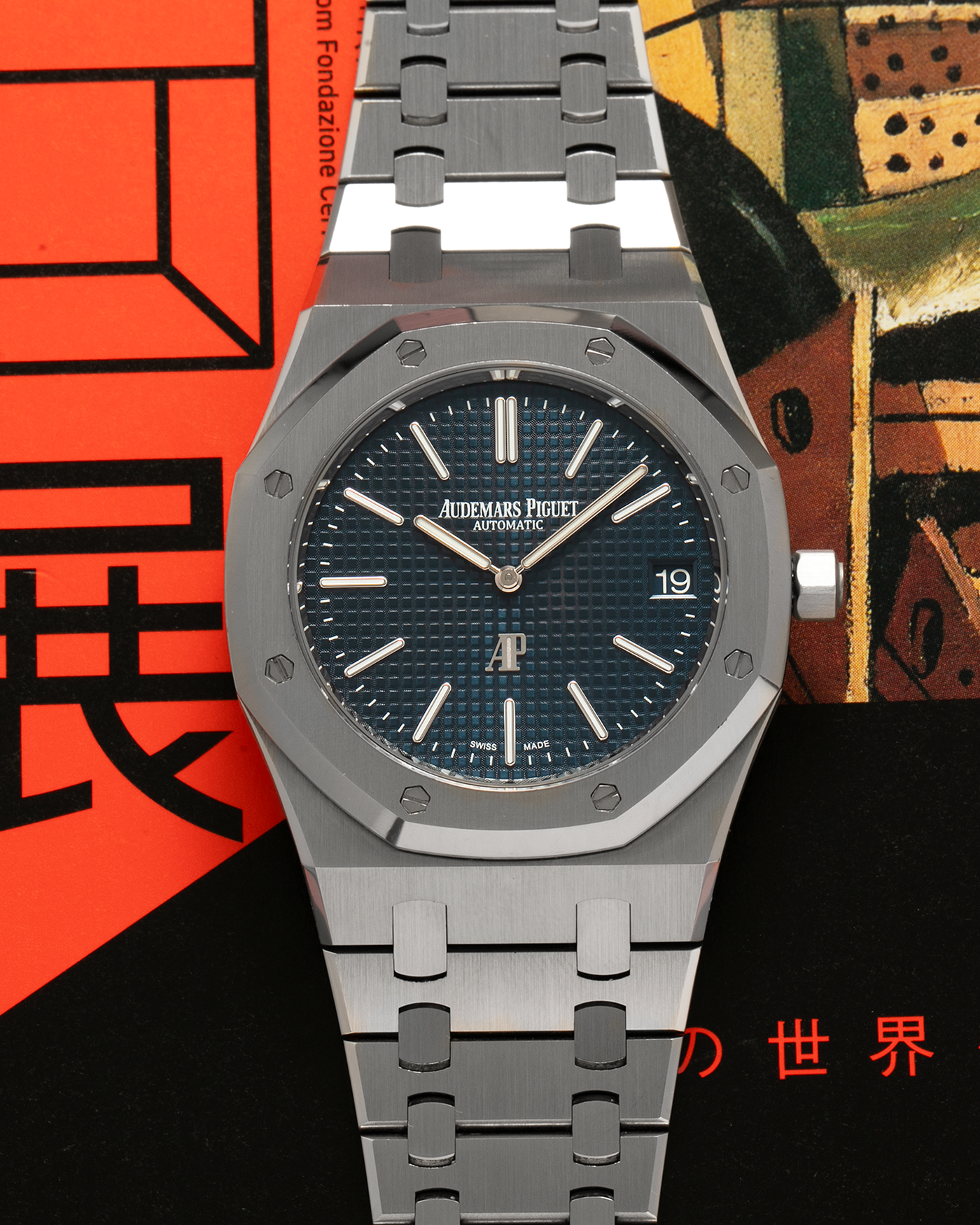 Brand: Audemars Piguet Year: 2022 Model: Royal Oak “Jumbo” Extra-Thin “50th Anniversary” Reference Number: 16202ST.OO.1240ST.01 Material: Stainless Steel Movement: Audemars Piguet Cal. 7121, Self-Winding (Special Engraved Rotor) Case Dimensions: 39mm x 8.1mm Bracelet: Audemars Piguet Stainless Steel Integrated Bracelet