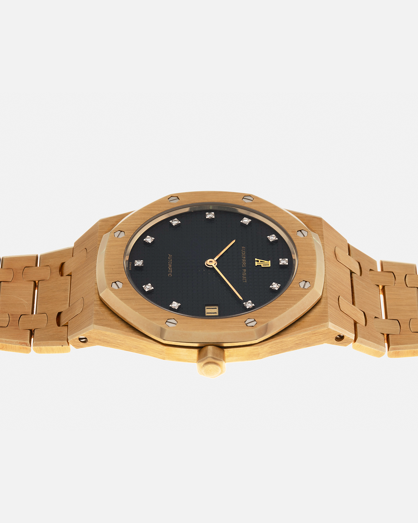 Brand: Audemars Piguet
Year: 1980’s
Model: Royal Oak
Reference Number: 5402BA
Serial Number: 5XX
Material: 18-carat Yellow Gold
Movement: Audemars Piguet Cal. 2121, Self-Winding
Case Dimensions: 39mm x 48mm (Including Lugs) x 7mm
Bracelet: Audemars Piguet Integrated Bracelet in 18-carat Yellow Gold