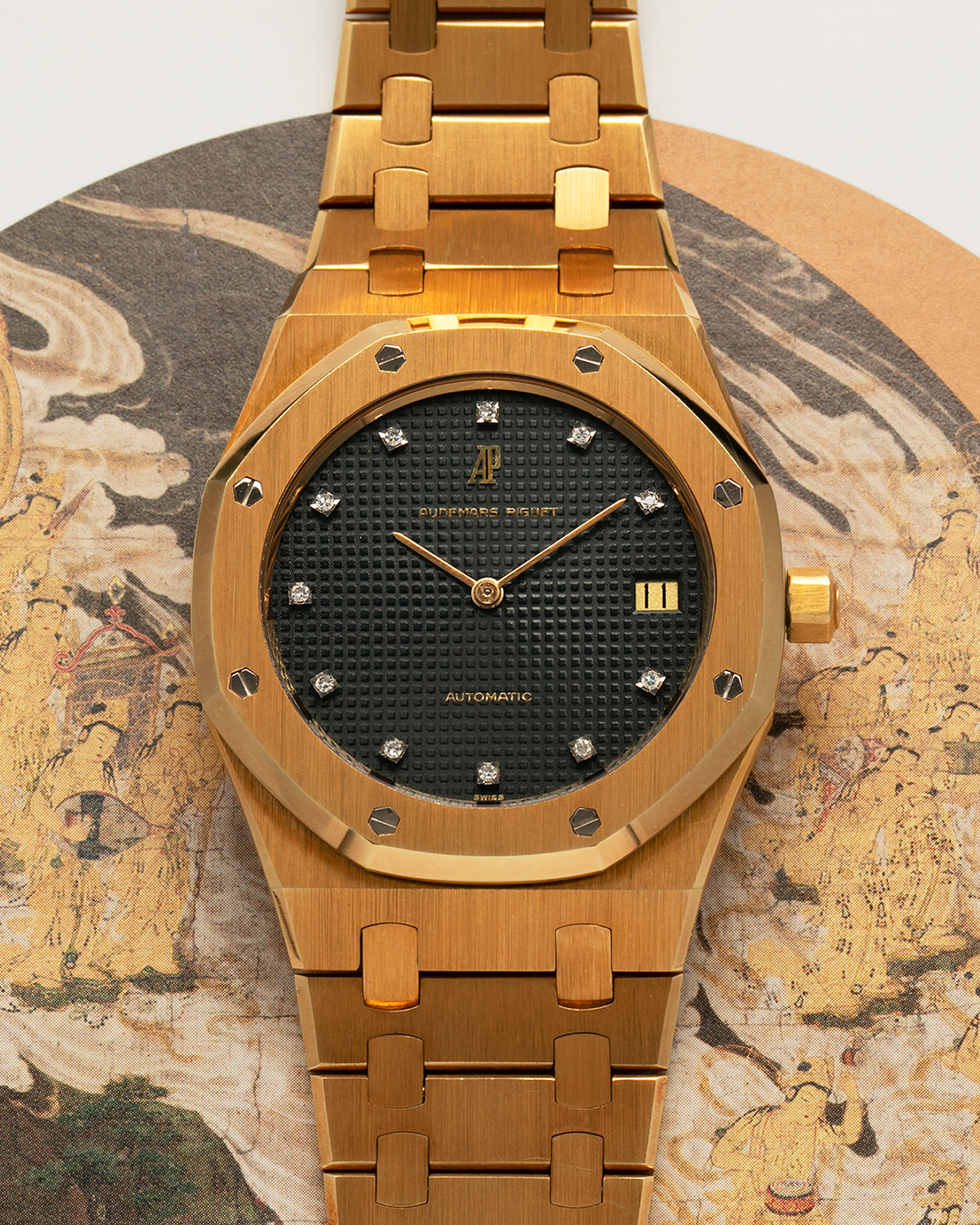 Brand: Audemars Piguet
Year: 1980’s
Model: Royal Oak
Reference Number: 5402BA
Serial Number: 5XX
Material: 18-carat Yellow Gold
Movement: Audemars Piguet Cal. 2121, Self-Winding
Case Dimensions: 39mm x 48mm (Including Lugs) x 7mm
Bracelet: Audemars Piguet Integrated Bracelet in 18-carat Yellow Gold