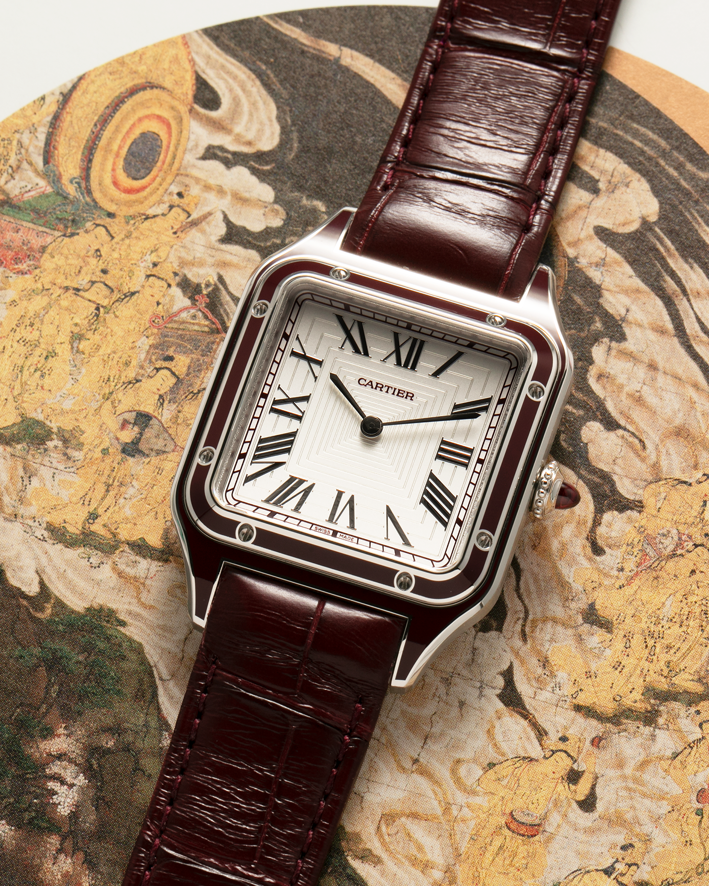 Brand: Cartier Year: 2022 Model: Santos-Dumont Large, Limited Edition of 150 pieces Reference Number: WGSA0053 Material: Platinum 950 Case, Burgundy Lacquered Bezel Movement: Cartier Cal. 430 MC, Manual-Winding Case Diameter: 43.5mm x 31.4mm Strap: Cartier Burgundy Alligator Leather Strap with Signed Platinum 950 Tang Buckle