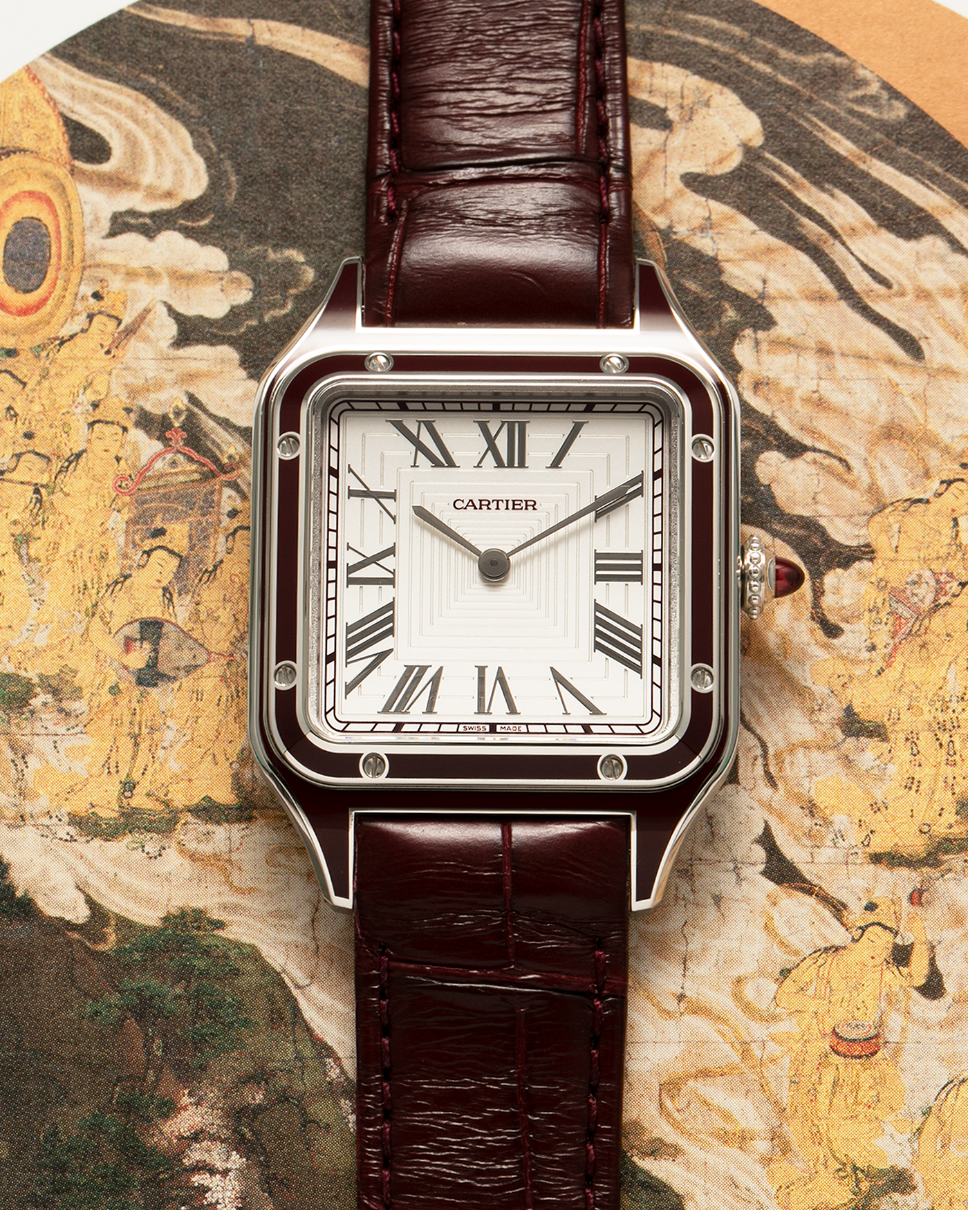 Brand: Cartier Year: 2022 Model: Santos-Dumont Large, Limited Edition of 150 pieces Reference Number: WGSA0053 Material: Platinum 950 Case, Burgundy Lacquered Bezel Movement: Cartier Cal. 430 MC, Manual-Winding Case Diameter: 43.5mm x 31.4mm Strap: Cartier Burgundy Alligator Leather Strap with Signed Platinum 950 Tang Buckle