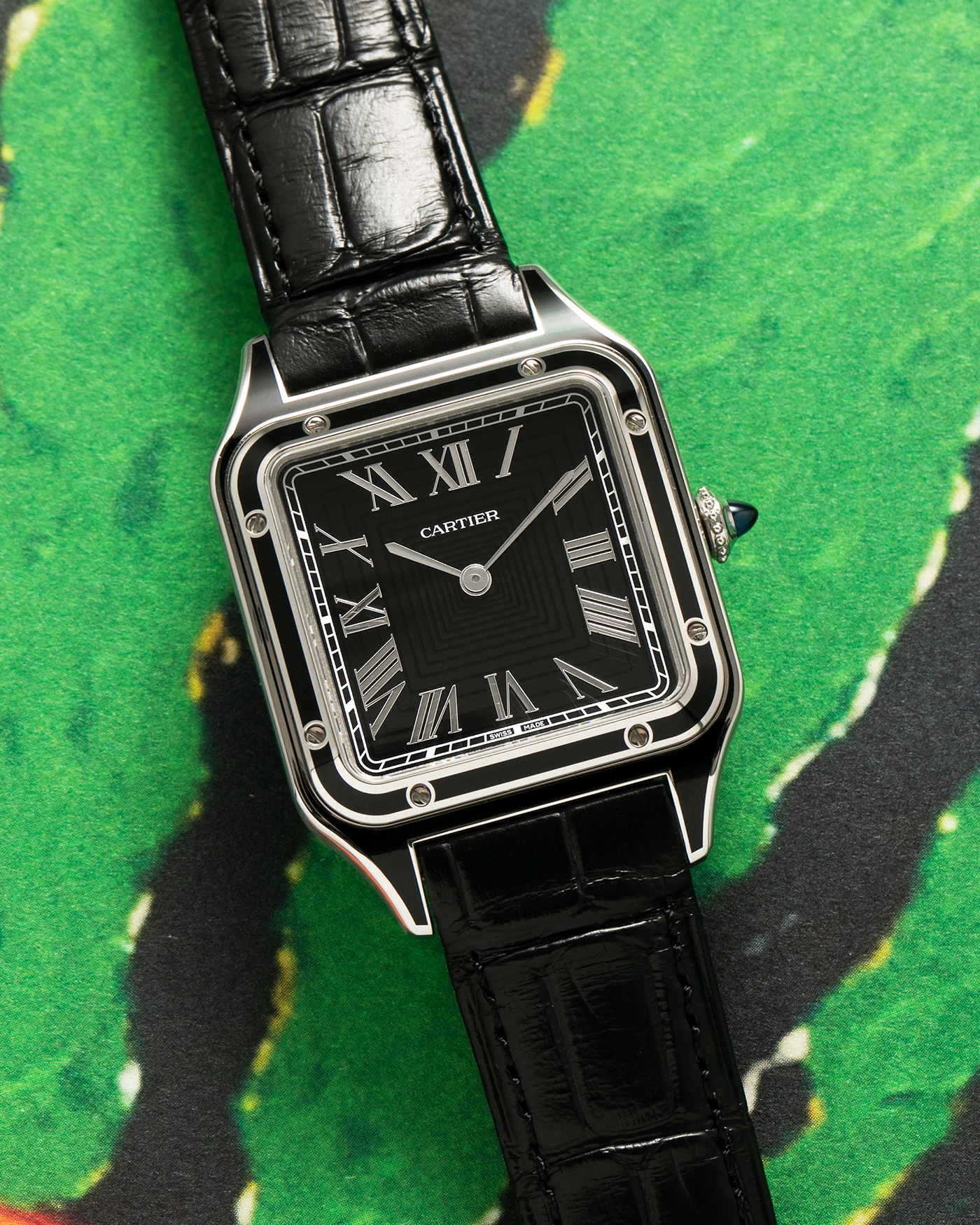 Brand: Cartier Year: 2023 Model: Santos-Dumont Large Reference: CRWSSA0046 Material: Stainless Steel, Black Lacquer Movement: Cartier Cal. 430 MC, Manual-Winding Case Diameter: 43.5mm x 31.4mm Strap: Cartier Black Alligator Leather Strap with Signed Stainless Steel Tang Buckle, Additional Generic Black Leather Strap