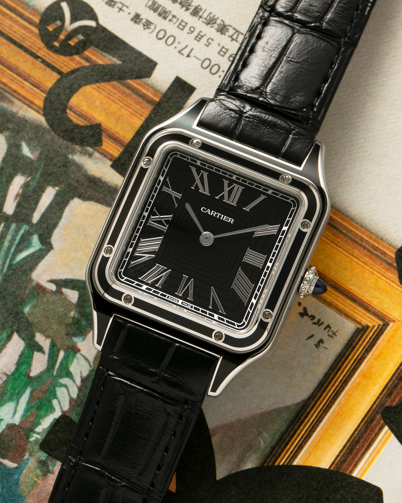 Brand: Cartier Year: 2023 Model: Santos-Dumont Large Reference: CRWSSA0046 Material: Stainless Steel, Black Lacquer Movement: Cartier Cal. 430 MC, Manual-Winding Case Diameter: 43.5mm x 31.4mm Strap: Cartier Black Alligator Leather Strap with Signed Stainless Steel Tang Buckle, Additional Generic Black Leather Strap