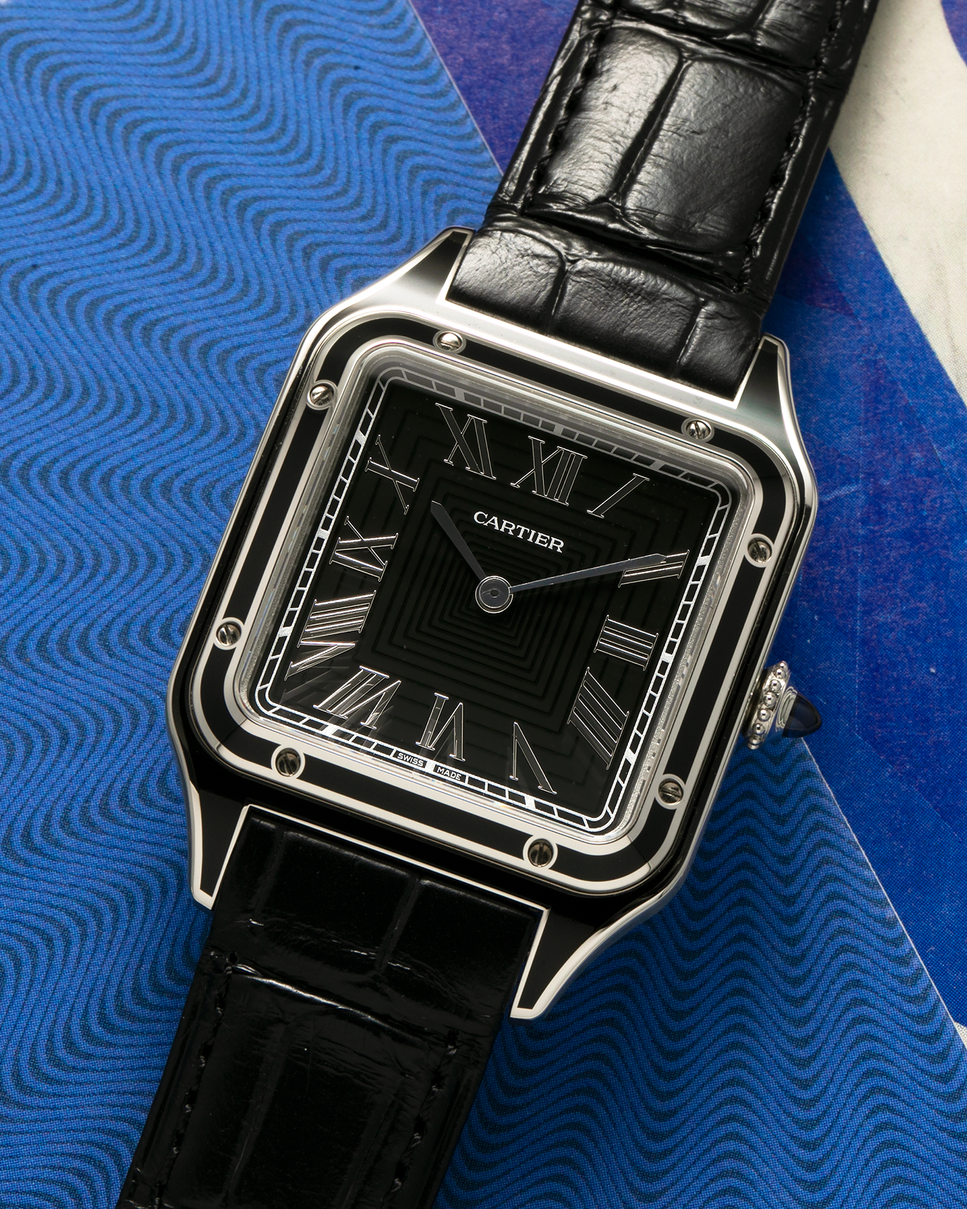 Brand: Cartier Year: 2023 Model: Santos-Dumont Large Reference: CRWSSA0046 Material: Stainless Steel, Black Lacquer Movement: Cartier Cal. 430 MC, Manual-Winding Case Diameter: 43.5mm x 31.4mm Strap: Cartier Black Alligator Leather Strap with Signed Stainless Steel Tang Buckle, Additional Generic Black Leather Strap