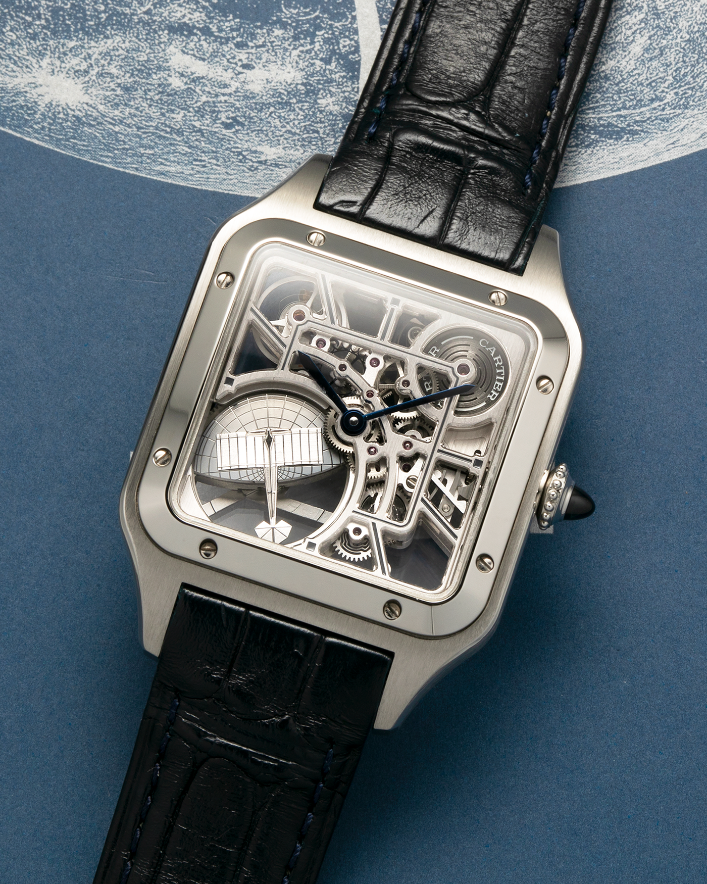 Brand: Cartier
Year: 2023
Model: Santos Dumont Skeleton Micro-Rotor
Reference: CRWHSA0032
Material: Stainless Steel
Movement: Cartier Cal. 9629 MC, Self-Winding Micro-Rotor
Case Dimensions: 31.4mm x 43.5mm (Including Lugs)
Strap: Cartier Dark Navy Alligator Leather Strap with Signed Stainless Steel Ardillon Buckle