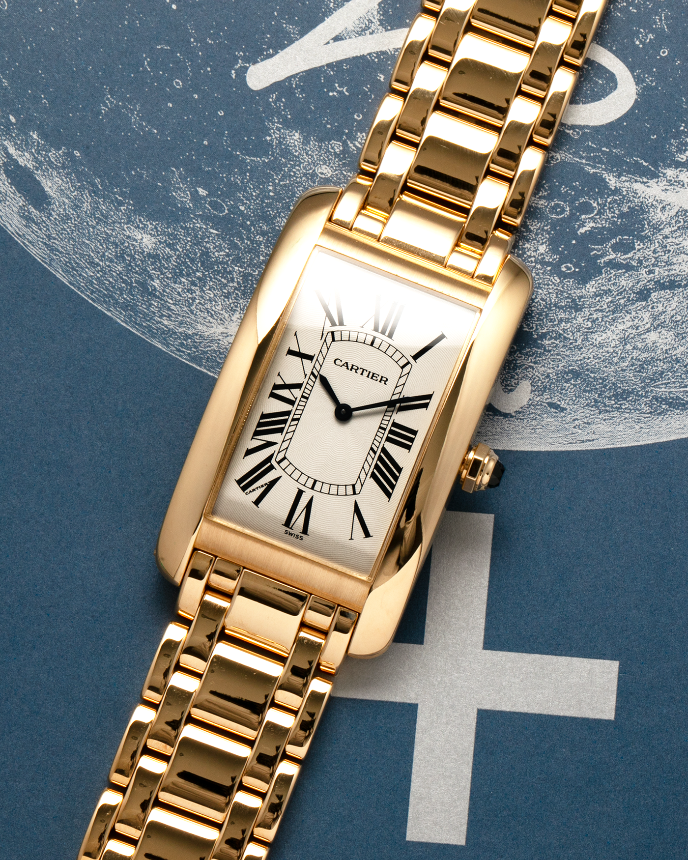 Brand: Cartier Year: 1990s Model: Tank Américaine Reference: 1735-1 Material: 18-carat Yellow Gold Movement: Cartier Cal. 430 MC (Piaget Cal. 430P based), Manual-Winding Case Dimensions: 44mm x 26mm x 7.5mm Lug Width: 18mm Bracelet: Cartier Bracelet in full 18-carat Yellow Gold with Signed Butterfly Clasp