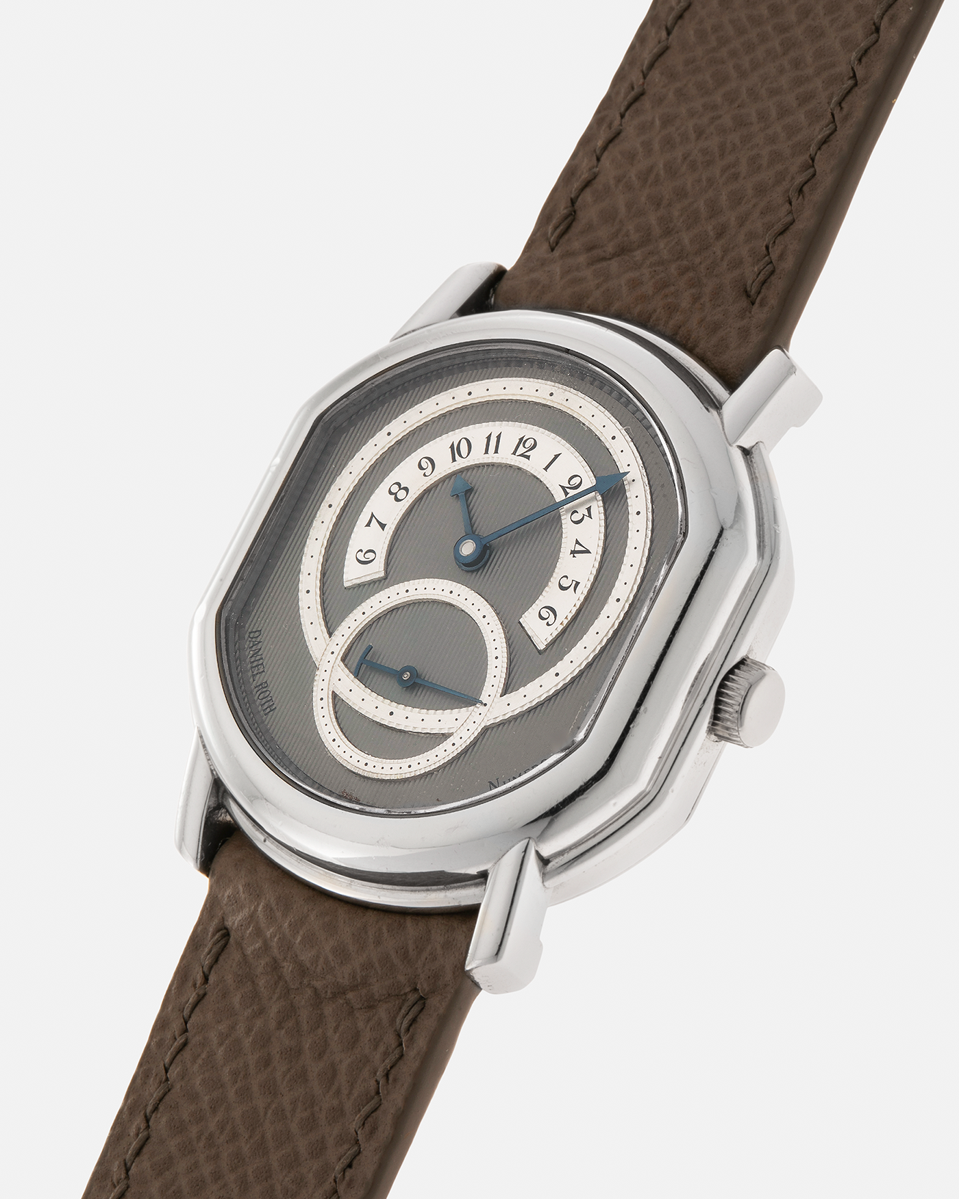 Brand: Daniel Roth Year: 1990’s Model: 2127 Retrograde Material: Platinum 950 Movement: Lemania Cal. 27LN Retrograde, Manual-Winding Case Dimensions: 35mm x 38mm Lug Width: 20mm Strap: Nostime Taupe Grained Calf Leather Strap with Signed Platinum 950 Tang Buckle