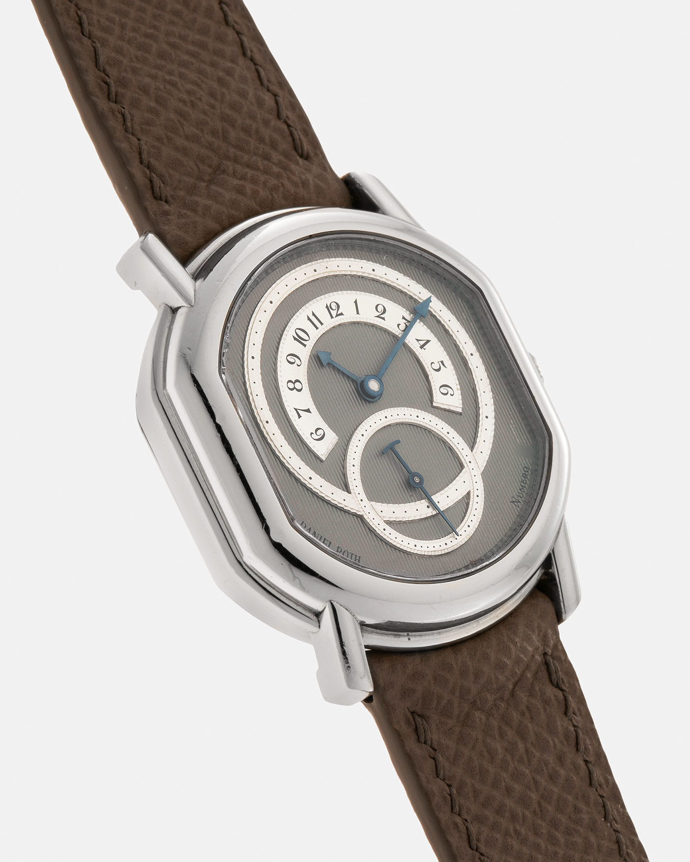 Brand: Daniel Roth Year: 1990’s Model: 2127 Retrograde Material: Platinum 950 Movement: Lemania Cal. 27LN Retrograde, Manual-Winding Case Dimensions: 35mm x 38mm Lug Width: 20mm Strap: Nostime Taupe Grained Calf Leather Strap with Signed Platinum 950 Tang Buckle