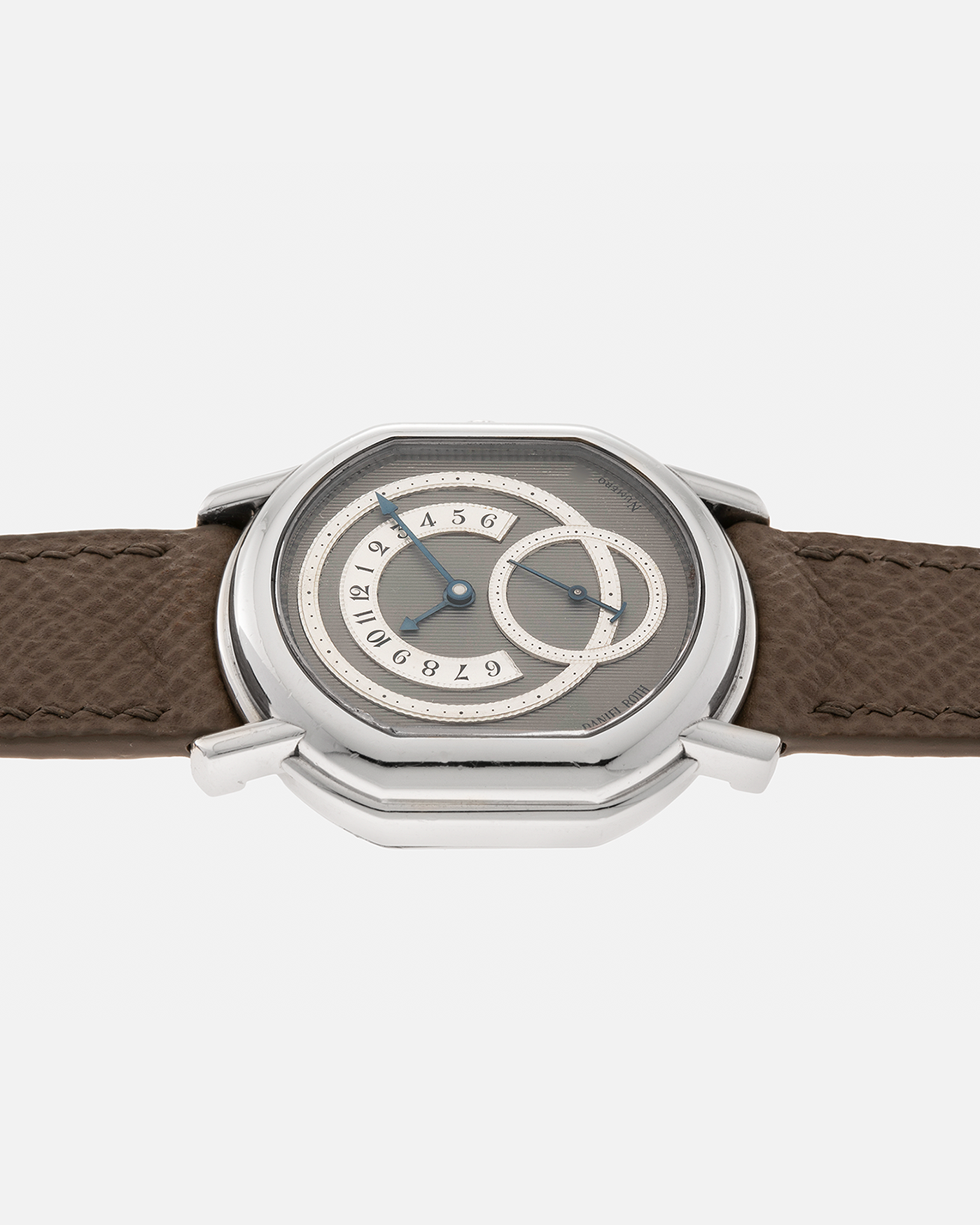 Brand: Daniel Roth Year: 1990’s Model: 2127 Retrograde Material: Platinum 950 Movement: Lemania Cal. 27LN Retrograde, Manual-Winding Case Dimensions: 35mm x 38mm Lug Width: 20mm Strap: Nostime Taupe Grained Calf Leather Strap with Signed Platinum 950 Tang Buckle