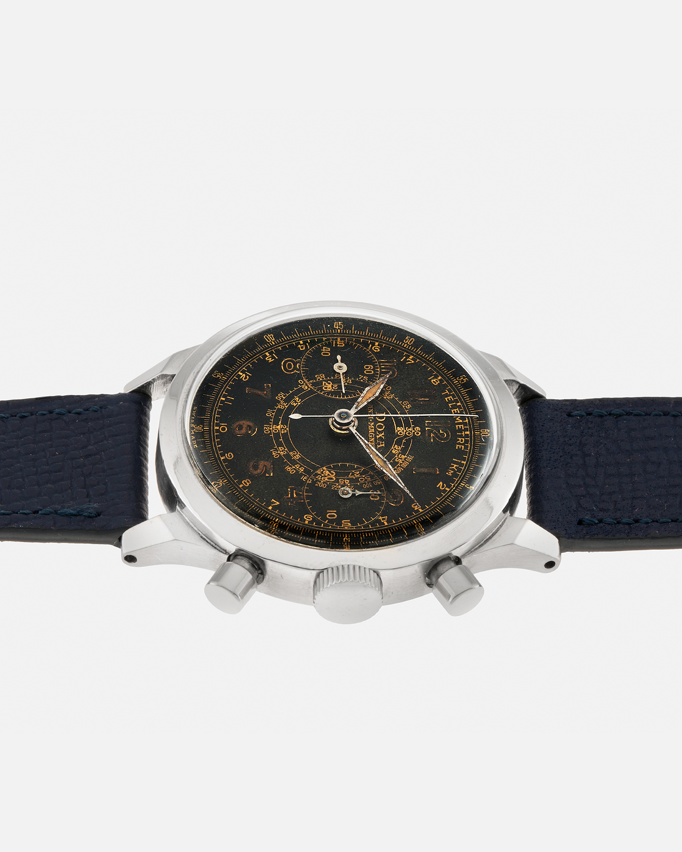 Brand: Doxa
Year: 1940s
Model: Anti-Magnetic Chronograph
Material: Stainless Steel
Movement: Valjoux Cal. 22, Manual-Winding
Case Diameter: 38mm
Lug Width: 19mm
Strap: Nostime Dark Navy Grained Calf Leather Strap