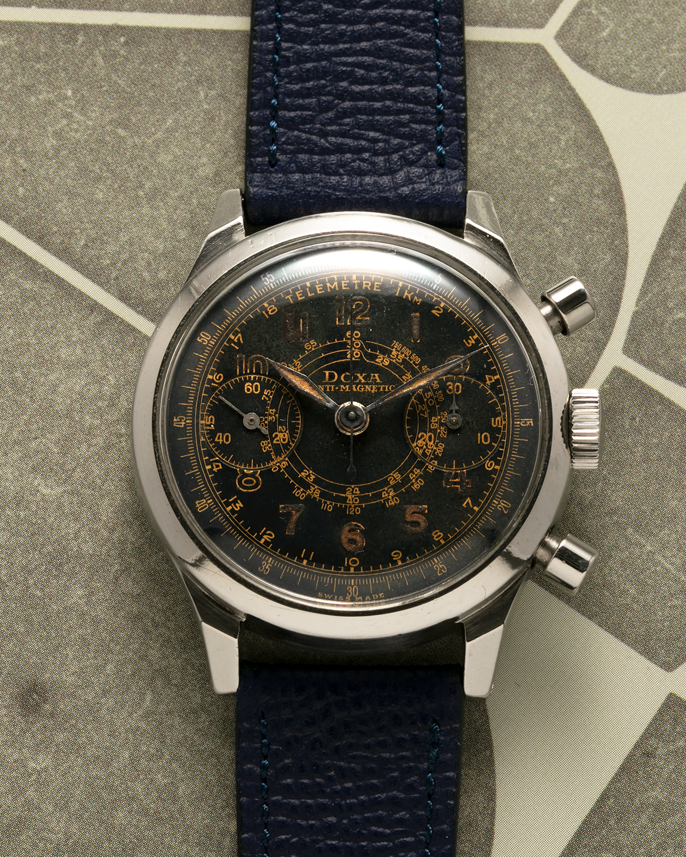 Brand: Doxa
Year: 1940s
Model: Anti-Magnetic Chronograph
Material: Stainless Steel
Movement: Valjoux Cal. 22, Manual-Winding
Case Diameter: 38mm
Lug Width: 19mm
Strap: Nostime Dark Navy Grained Calf Leather Strap