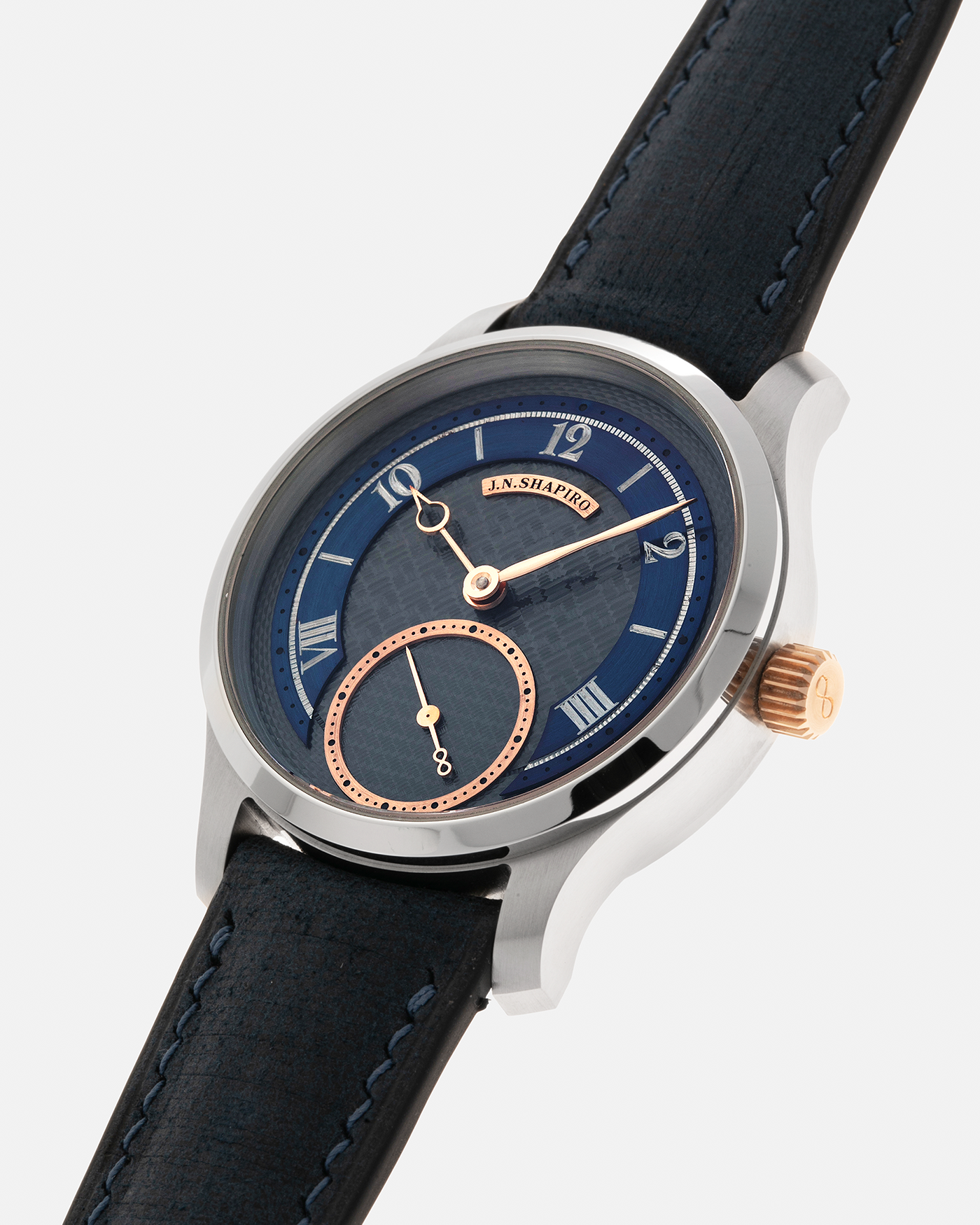 Brand: J.N. Shapiro
Year: 2023
Model: Infinity Series 1.5
Serial Number: S.1
Material: Stainless Steel Case, Black Zirconium Dial, Rose Gold Hands, Crown and Inlays
Movement: UWD Cal. 33.1, Manual-Winding
Case Dimensions: 39mm x 9.75mm (47mm Lug-to-Lug)
Lug Width: 20mm
Strap: J.N. Shapiro x Delugs Navy Blue Leather Strap with Signed Stainless Steel Tang Buckle