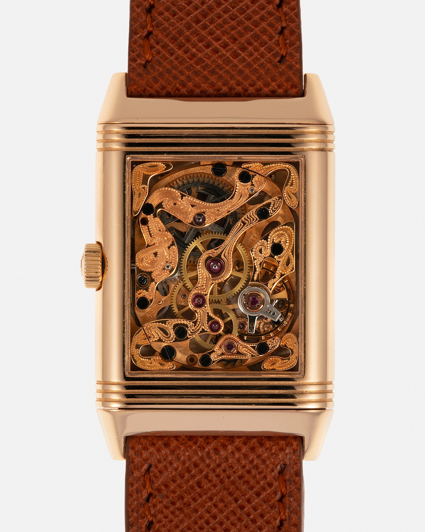 Brand: Jaeger LeCoultre
Year: 1990s
Model: Reverso Art Deco Skeleton Movement (Only 900 Pieces Made in Rose Gold)
Reference Number: 270.2.62 / Q2772420
Material: 18-carat Rose Gold
Movement: Jaeger LeCoultre Cal. 822AD, Manual-Winding
Case Diameter: 42mm (Including Lugs) x 26mm x 9.5mm
Lug Width: 19mm
Strap: Mr Watchley Saffiano Copper Brown Leather Strap with Signed 18-carat Rose Gold Deployant Clasp