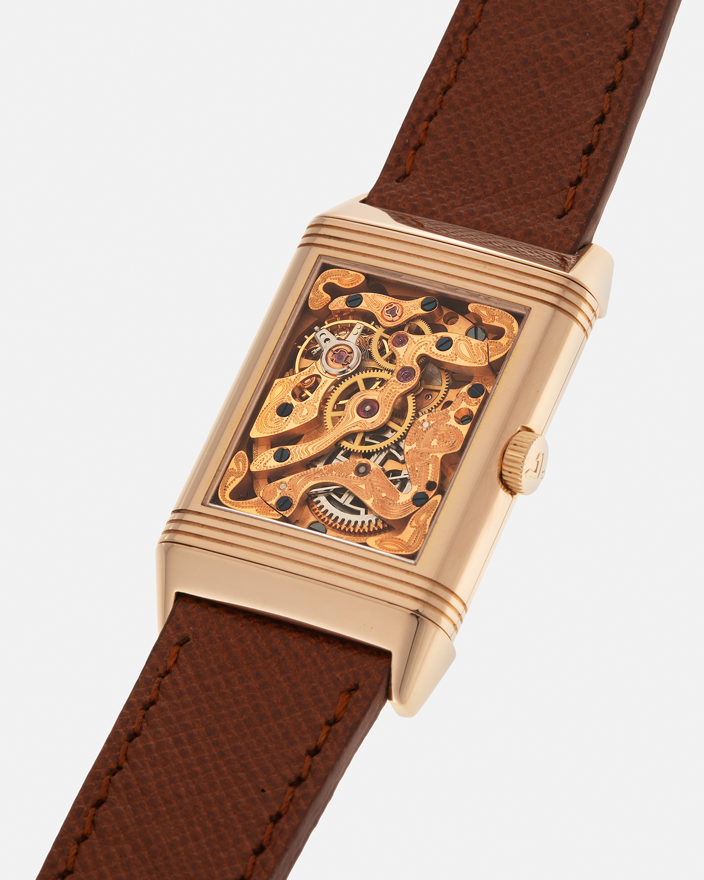 Brand: Jaeger LeCoultre
Year: 1990s
Model: Reverso Art Deco Skeleton Movement (Only 900 Pieces Made in Rose Gold)
Reference Number: 270.2.62 / Q2772420
Material: 18-carat Rose Gold
Movement: Jaeger LeCoultre Cal. 822AD, Manual-Winding
Case Diameter: 42mm (Including Lugs) x 26mm x 9.5mm
Lug Width: 19mm
Strap: Mr Watchley Saffiano Copper Brown Leather Strap with Signed 18-carat Rose Gold Deployant Clasp