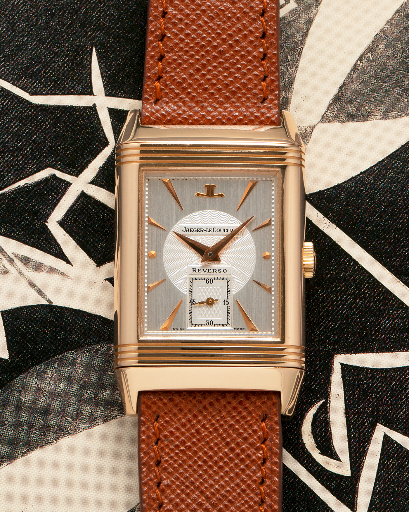 Brand: Jaeger LeCoultre
Year: 1990s
Model: Reverso Art Deco Skeleton Movement (Only 900 Pieces Made in Rose Gold)
Reference Number: 270.2.62 / Q2772420
Material: 18-carat Rose Gold
Movement: Jaeger LeCoultre Cal. 822AD, Manual-Winding
Case Diameter: 42mm (Including Lugs) x 26mm x 9.5mm
Lug Width: 19mm
Strap: Mr Watchley Saffiano Copper Brown Leather Strap with Signed 18-carat Rose Gold Deployant Clasp