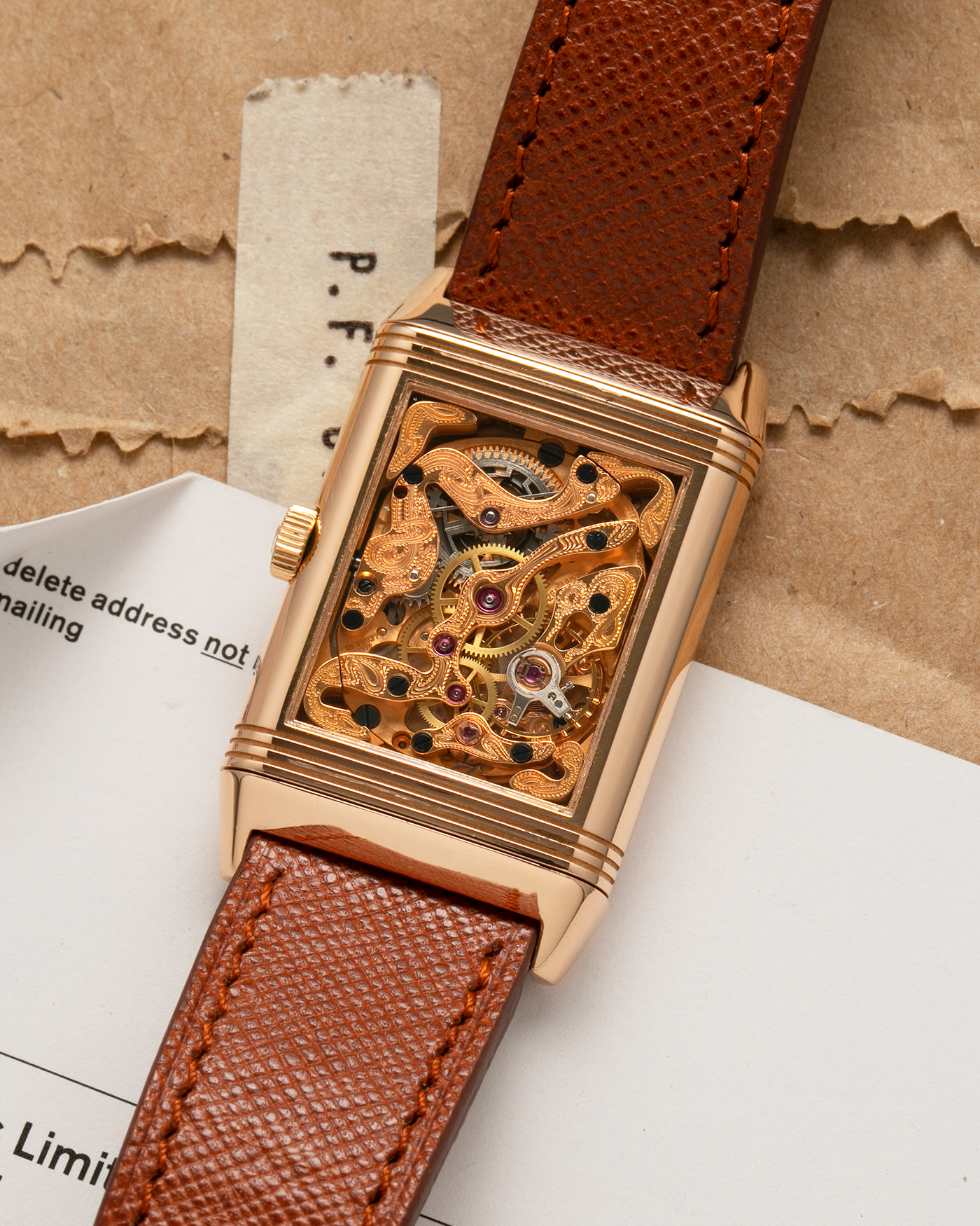 Brand: Jaeger LeCoultre
Year: 1990s
Model: Reverso Art Deco Skeleton Movement (Only 900 Pieces Made in Rose Gold)
Reference Number: 270.2.62 / Q2772420
Material: 18-carat Rose Gold
Movement: Jaeger LeCoultre Cal. 822AD, Manual-Winding
Case Diameter: 42mm (Including Lugs) x 26mm x 9.5mm
Lug Width: 19mm
Strap: Mr Watchley Saffiano Copper Brown Leather Strap with Signed 18-carat Rose Gold Deployant Clasp