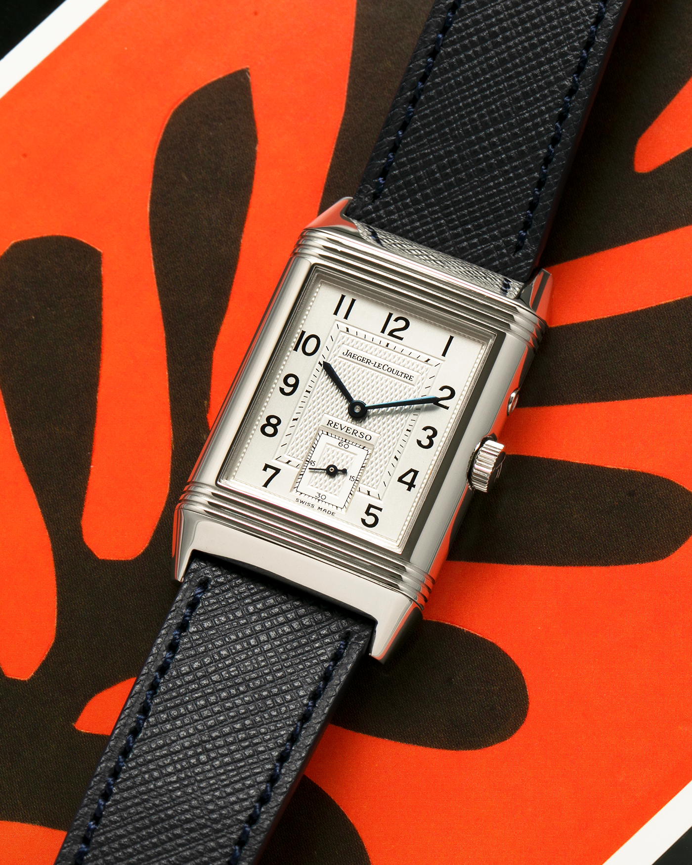 Brand: Jaeger-LeCoultre
Year: 2000’s
Model: Reverso Duoface Japan Edition Red, Ref. 270.8.54, Limited Edition of 300 Pieces
Material: Stainless Steel
Movement: Jaeger LeCoultre Cal. 854, Manual-Wind
Case Diameter: 26mm x 10mm x 42mm (Including Lugs)
Lug Width: 19mm
Strap: Molequin Dark Navy Blue Textured Calf with Signed Stainless Steel Deployant Clasp