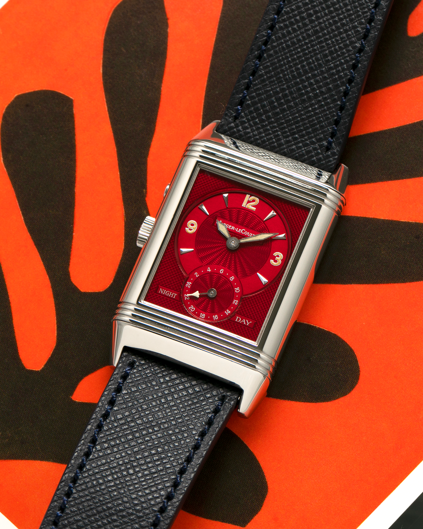 Brand: Jaeger-LeCoultre
Year: 2000’s
Model: Reverso Duoface Japan Edition Red, Ref. 270.8.54, Limited Edition of 300 Pieces
Material: Stainless Steel
Movement: Jaeger LeCoultre Cal. 854, Manual-Wind
Case Diameter: 26mm x 10mm x 42mm (Including Lugs)
Lug Width: 19mm
Strap: Molequin Dark Navy Blue Textured Calf with Signed Stainless Steel Deployant Clasp