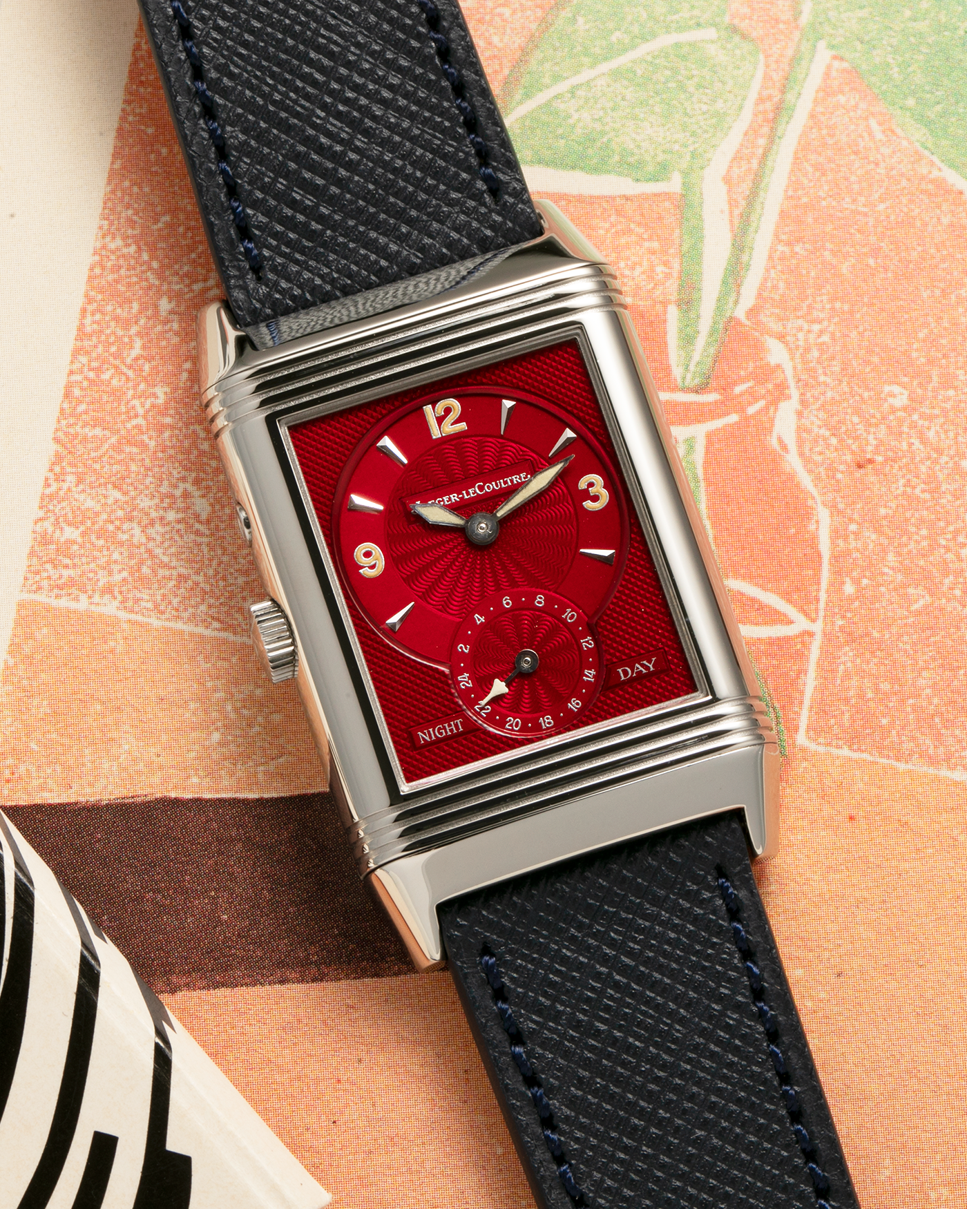 Brand: Jaeger-LeCoultre
Year: 2000’s
Model: Reverso Duoface Japan Edition Red, Ref. 270.8.54, Limited Edition of 300 Pieces
Material: Stainless Steel
Movement: Jaeger LeCoultre Cal. 854, Manual-Wind
Case Diameter: 26mm x 10mm x 42mm (Including Lugs)
Lug Width: 19mm
Strap: Molequin Dark Navy Blue Textured Calf with Signed Stainless Steel Deployant Clasp