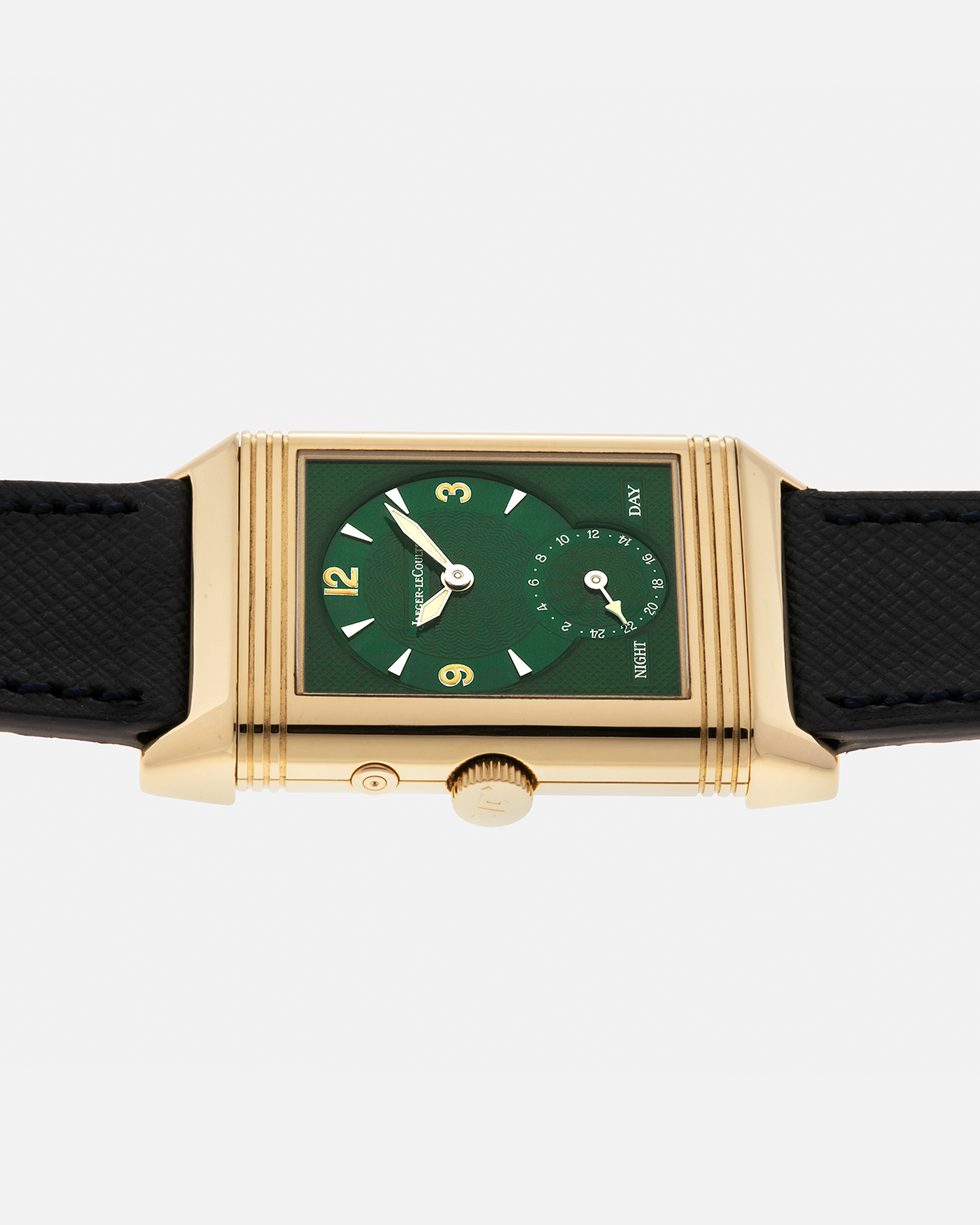 Brand: Jaeger LeCoultre
Year: 1990s
Model: Reverso Duoface Japan Edition Green, Limited Edition of 39 Pieces
Reference Number: 270.1.54
Material: 18-carat Yellow Gold
Movement: Jaeger LeCoultre Cal. 854, Manual-Wind
Case Diameter: 42mm (including lugs) x 26mm x 9.5mm
Lug Width: 19mm
Strap/Bracelet: Molequin Navy Blue Textured Calf Leather Strap with 18 carat JLC deployant clasp, with additional Two-Toned Jaeger LeCoultre signed bracelet