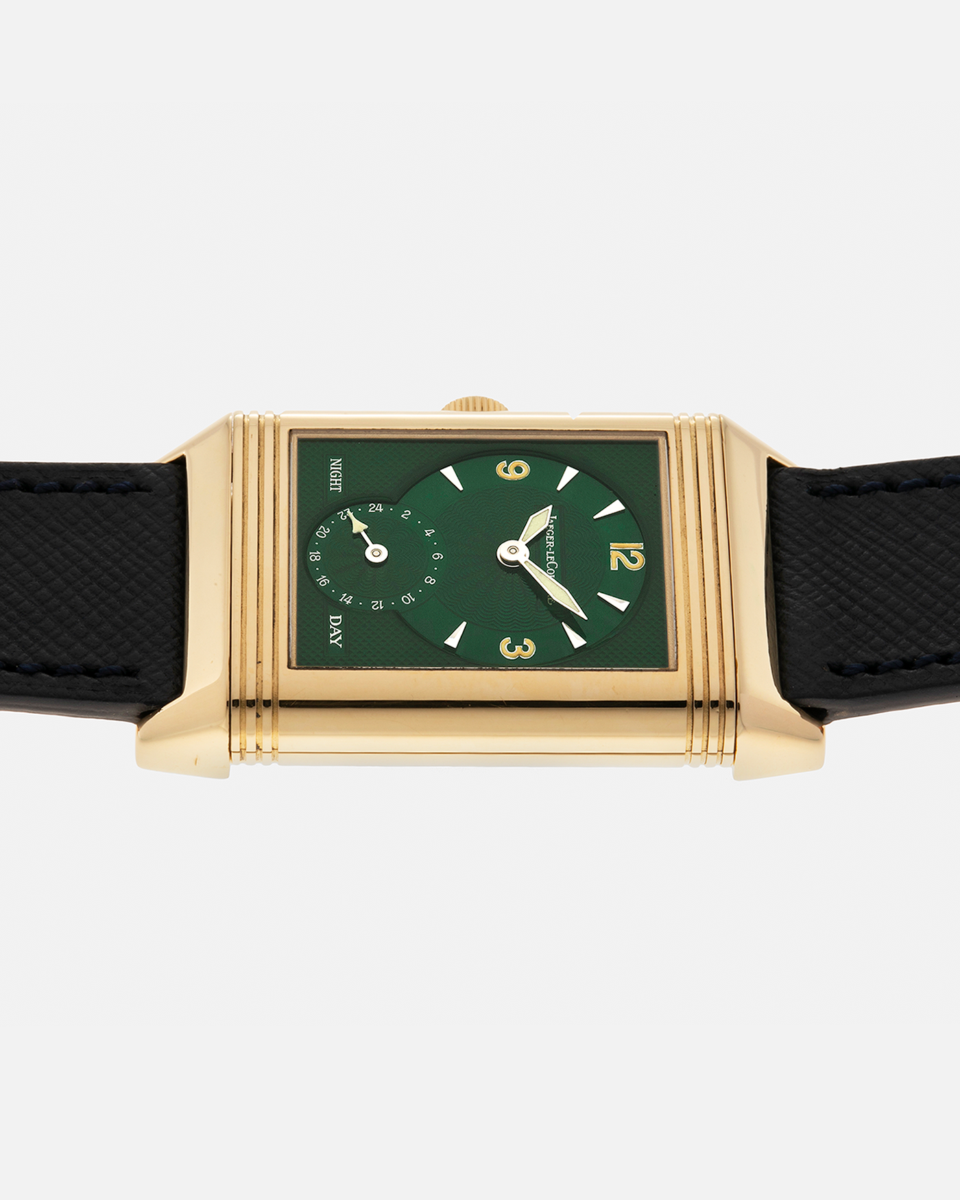 Brand: Jaeger LeCoultre
Year: 1990s
Model: Reverso Duoface Japan Edition Green, Limited Edition of 39 Pieces
Reference Number: 270.1.54
Material: 18-carat Yellow Gold
Movement: Jaeger LeCoultre Cal. 854, Manual-Wind
Case Diameter: 42mm (including lugs) x 26mm x 9.5mm
Lug Width: 19mm
Strap/Bracelet: Molequin Navy Blue Textured Calf Leather Strap with 18 carat JLC deployant clasp, with additional Two-Toned Jaeger LeCoultre signed bracelet