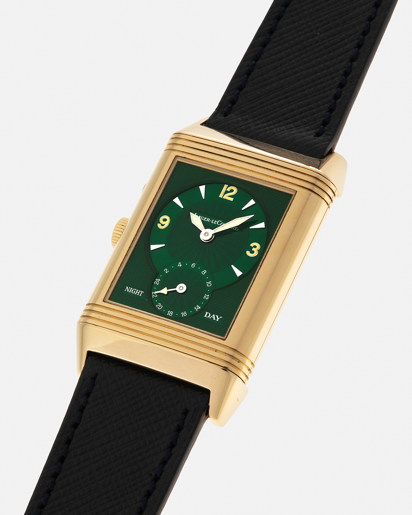 Brand: Jaeger LeCoultre
Year: 1990s
Model: Reverso Duoface Japan Edition Green, Limited Edition of 39 Pieces
Reference Number: 270.1.54
Material: 18-carat Yellow Gold
Movement: Jaeger LeCoultre Cal. 854, Manual-Wind
Case Diameter: 42mm (including lugs) x 26mm x 9.5mm
Lug Width: 19mm
Strap/Bracelet: Molequin Navy Blue Textured Calf Leather Strap with 18 carat JLC deployant clasp, with additional Two-Toned Jaeger LeCoultre signed bracelet