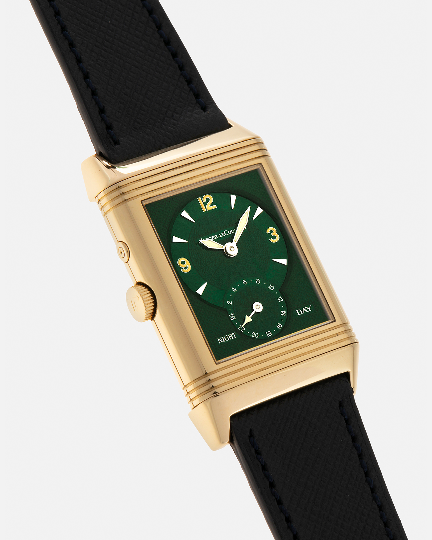 Brand: Jaeger LeCoultre
Year: 1990s
Model: Reverso Duoface Japan Edition Green, Limited Edition of 39 Pieces
Reference Number: 270.1.54
Material: 18-carat Yellow Gold
Movement: Jaeger LeCoultre Cal. 854, Manual-Wind
Case Diameter: 42mm (including lugs) x 26mm x 9.5mm
Lug Width: 19mm
Strap/Bracelet: Molequin Navy Blue Textured Calf Leather Strap with 18 carat JLC deployant clasp, with additional Two-Toned Jaeger LeCoultre signed bracelet