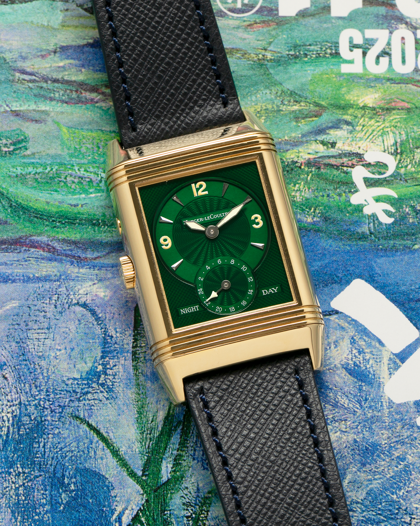 Brand: Jaeger LeCoultre
Year: 1990s
Model: Reverso Duoface Japan Edition Green, Limited Edition of 39 Pieces
Reference Number: 270.1.54
Material: 18-carat Yellow Gold
Movement: Jaeger LeCoultre Cal. 854, Manual-Wind
Case Diameter: 42mm (including lugs) x 26mm x 9.5mm
Lug Width: 19mm
Strap/Bracelet: Molequin Navy Blue Textured Calf Leather Strap with 18 carat JLC deployant clasp, with additional Two-Toned Jaeger LeCoultre signed bracelet