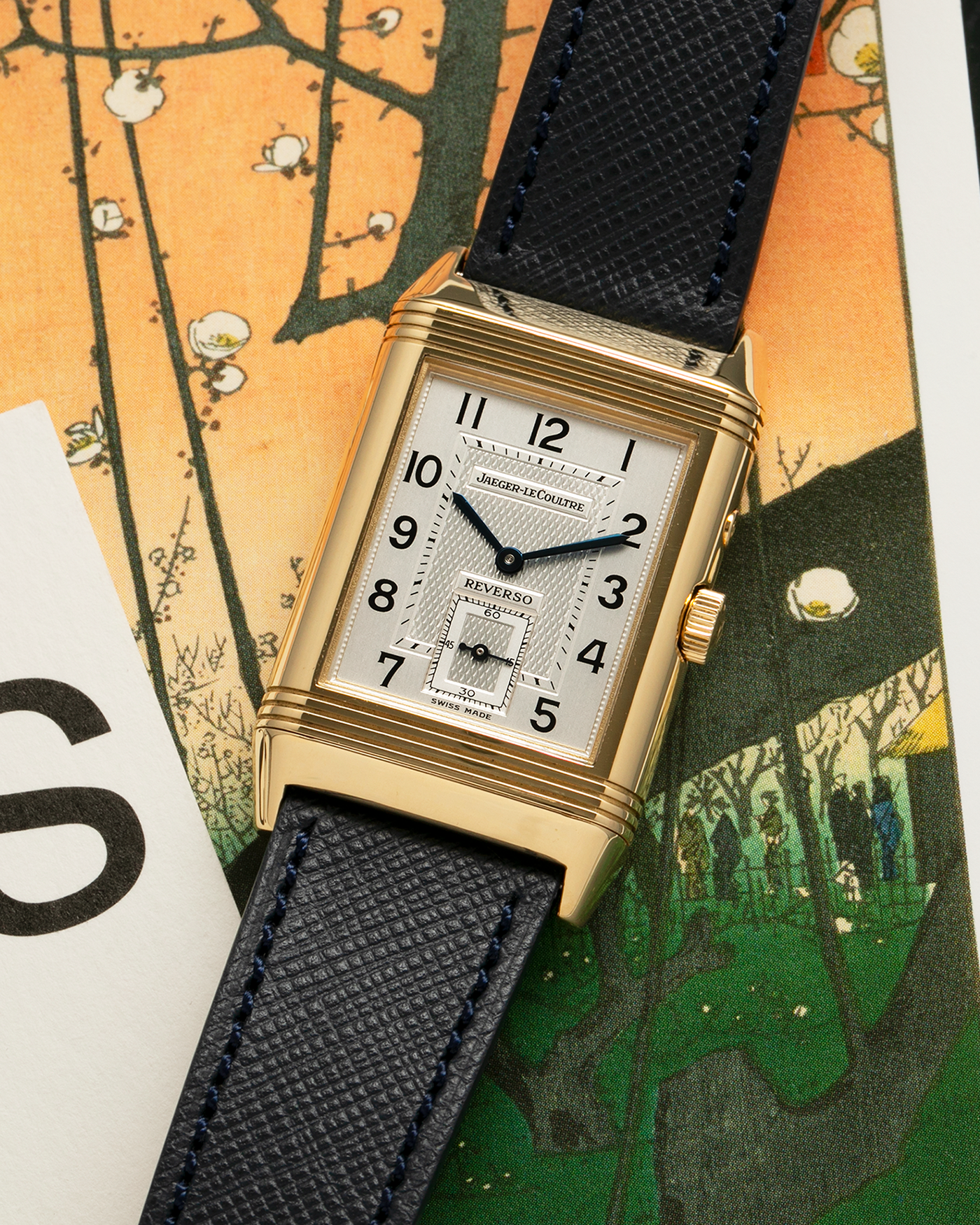 Brand: Jaeger LeCoultre
Year: 1990s
Model: Reverso Duoface Japan Edition Green, Limited Edition of 39 Pieces
Reference Number: 270.1.54
Material: 18-carat Yellow Gold
Movement: Jaeger LeCoultre Cal. 854, Manual-Wind
Case Diameter: 42mm (including lugs) x 26mm x 9.5mm
Lug Width: 19mm
Strap/Bracelet: Molequin Navy Blue Textured Calf Leather Strap with 18 carat JLC deployant clasp, with additional Two-Toned Jaeger LeCoultre signed bracelet