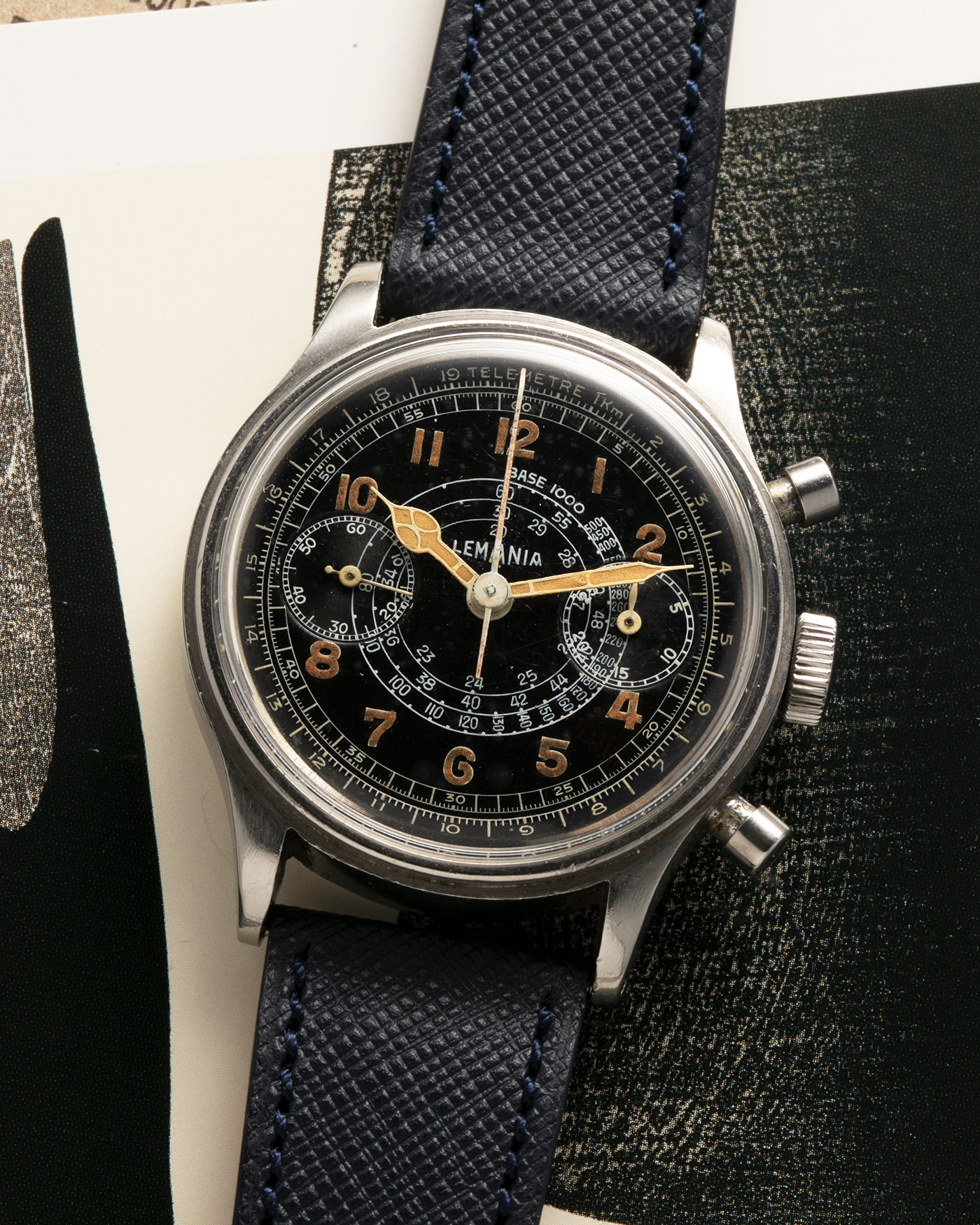 Brand: Lemania
Year: 1940’s
Model: 15TL
Material: Stainless Steel
Movement: Lemania Cal. 15TL, Manual-Winding
Case Dimensions: 38mm x 14mm (Lug-to-Lug 45.25mm)
Lug Width: 20mm
Strap: Nostime Dark Navy Textured Calf Leather Strap