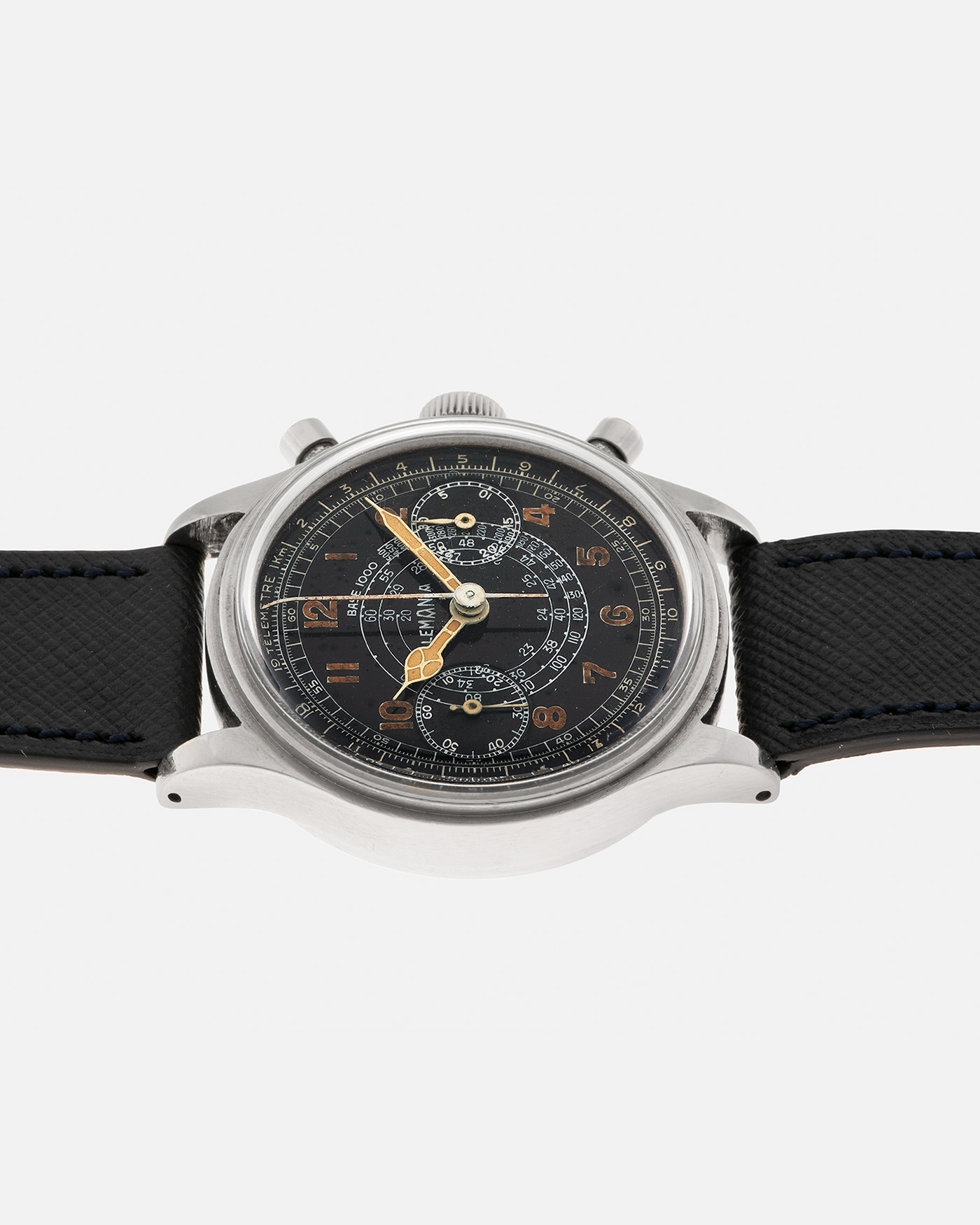 Brand: Lemania
Year: 1940’s
Model: 15TL
Material: Stainless Steel
Movement: Lemania Cal. 15TL, Manual-Winding
Case Dimensions: 38mm x 14mm (Lug-to-Lug 45.25mm)
Lug Width: 20mm
Strap: Nostime Dark Navy Textured Calf Leather Strap