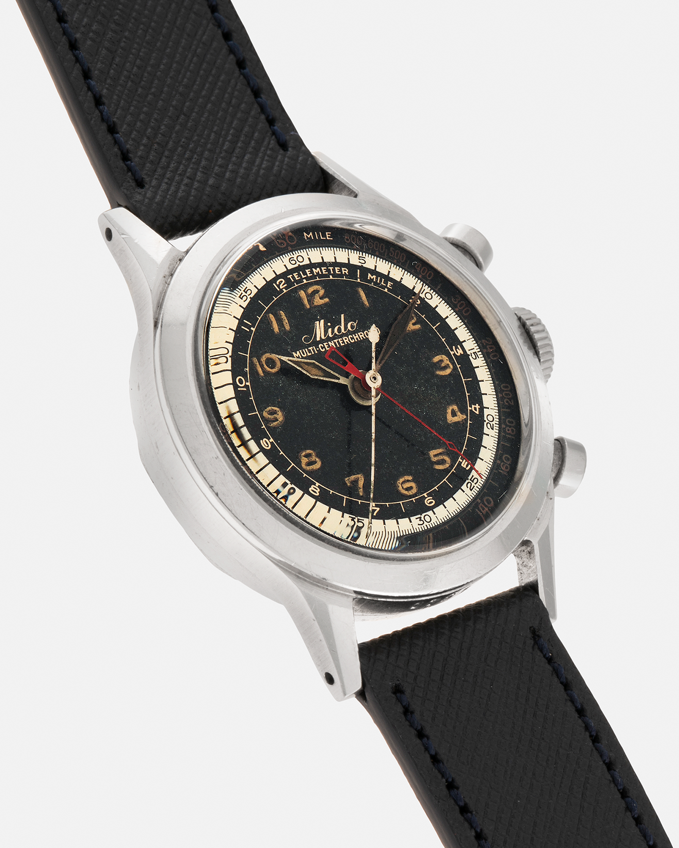 Brand: Mido
Year: Late 1940’s
Model: Multi-Centerchrono
Material: Stainless Steel
Movement: Mido Cal. 1300 (Modified Valjoux ZN), Manual-Winding
Case Diameter: 35mm
Lug Width: 18mm
Strap: Molequin Black Textured Calf Leather Strap