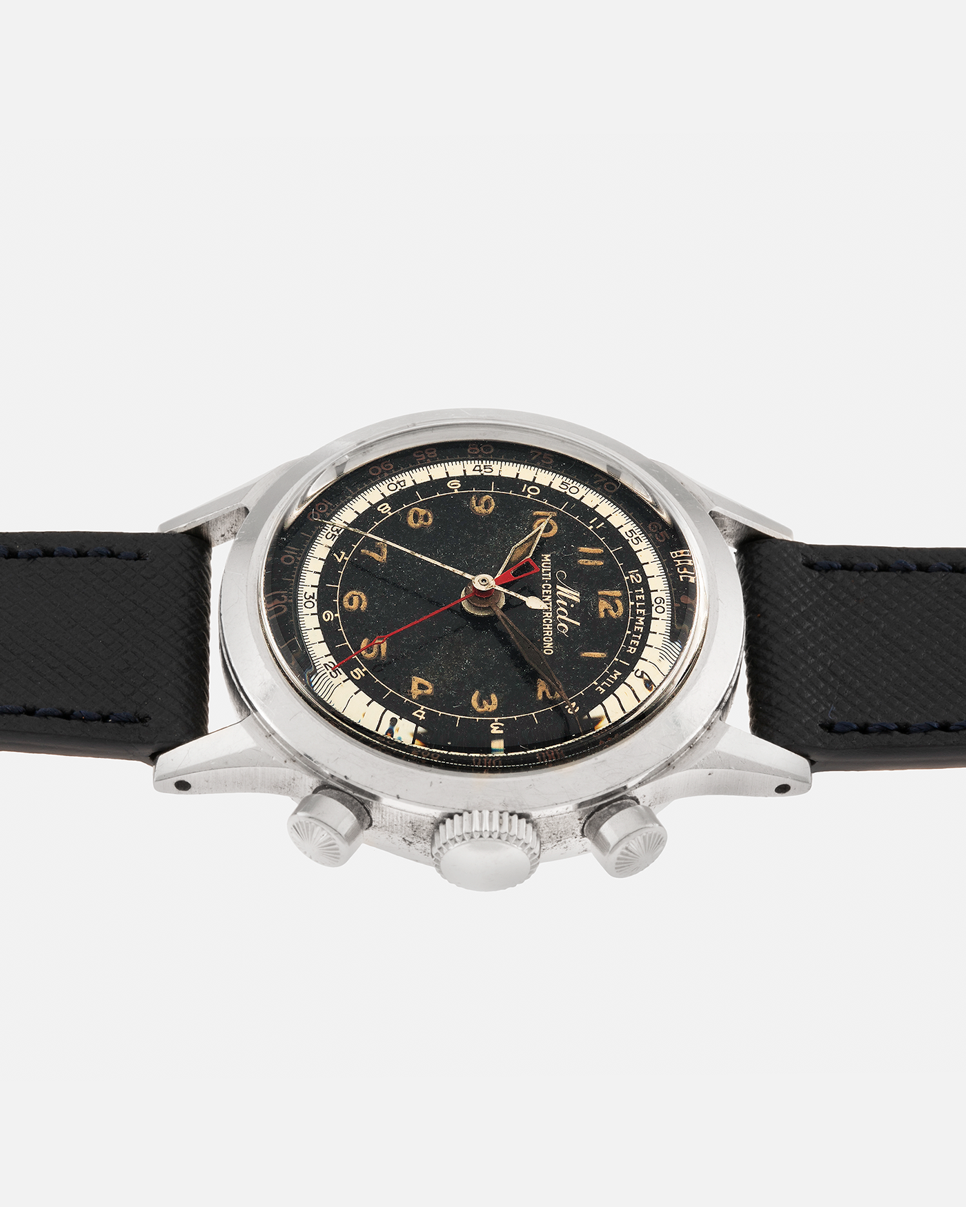 Brand: Mido
Year: Late 1940’s
Model: Multi-Centerchrono
Material: Stainless Steel
Movement: Mido Cal. 1300 (Modified Valjoux ZN), Manual-Winding
Case Diameter: 35mm
Lug Width: 18mm
Strap: Molequin Black Textured Calf Leather Strap