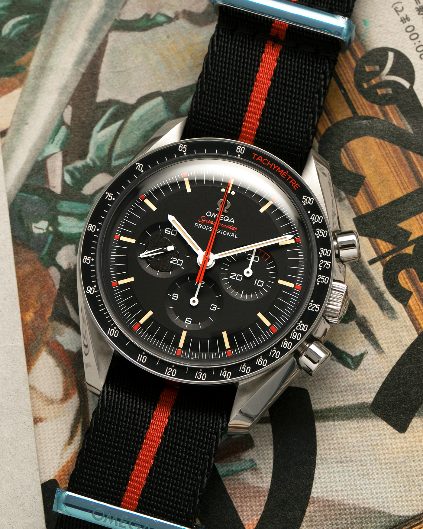 Brand: Omega
Year: 2018
Model: Speedmaster Professional Speedy Tuesday ‘Ultraman’, Limited Edition of 2,012 pieces
Reference Number: 311.12.42.30.01.001
Material: Stainless Steel
Movement: Omega Cal. 1861, Manual-Winding
Case Dimensions: 42mm x 14mm (Lug-to-Lug 47.5mm)
Lug Width: 20mm
Strap: Omega Black-Red NATO Strap with Signed Hardware and Stainless Steel Tang Buckle, with additional Omega Black Leather Strap with Minimalist Red Contrast Stitching and extra Signed Stainless Steel Tang Buckle