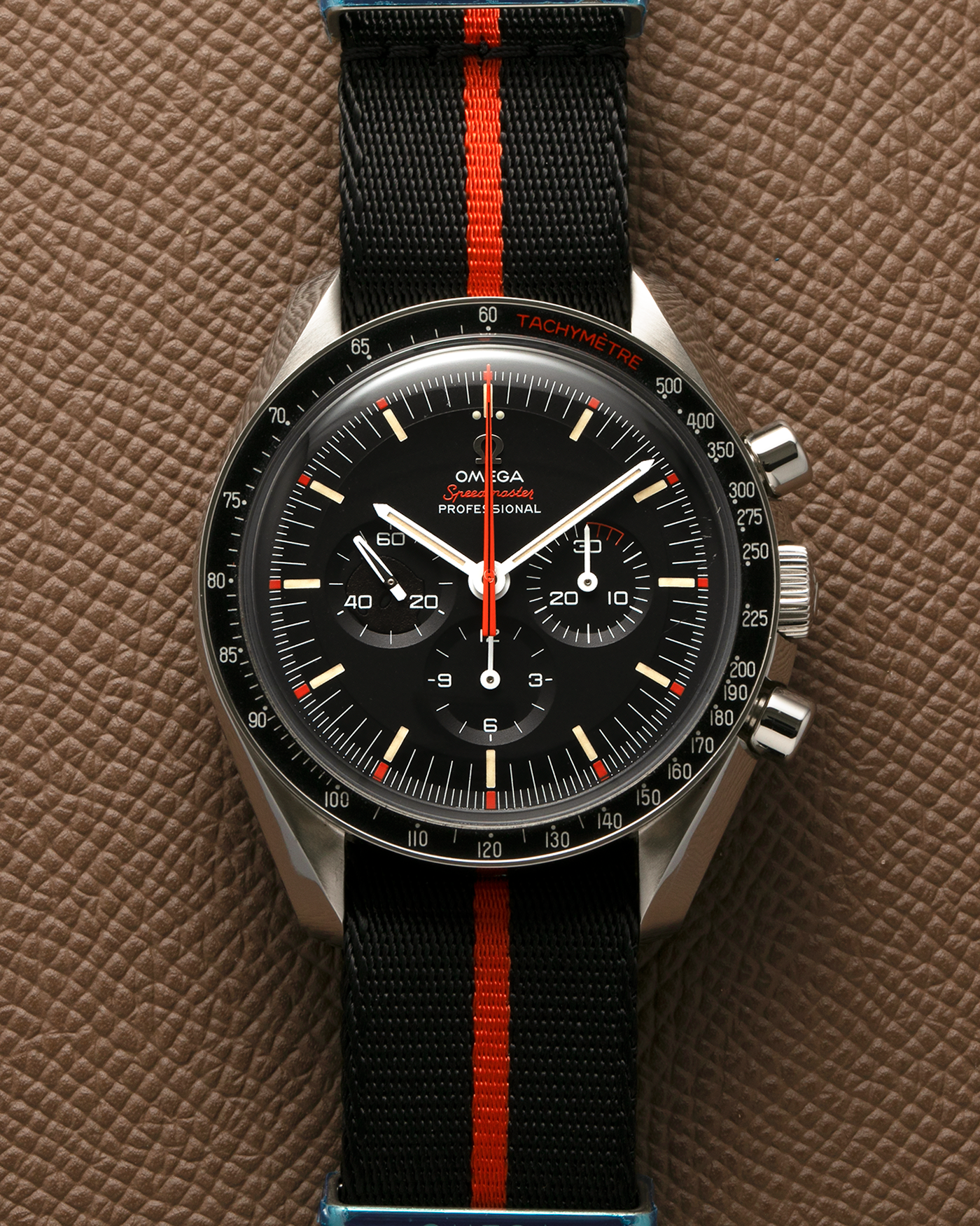 Brand: Omega
Year: 2018
Model: Speedmaster Professional Speedy Tuesday ‘Ultraman’, Limited Edition of 2,012 pieces
Reference Number: 311.12.42.30.01.001
Material: Stainless Steel
Movement: Omega Cal. 1861, Manual-Winding
Case Dimensions: 42mm x 14mm (Lug-to-Lug 47.5mm)
Lug Width: 20mm
Strap: Omega Black-Red NATO Strap with Signed Hardware and Stainless Steel Tang Buckle, with additional Omega Black Leather Strap with Minimalist Red Contrast Stitching and extra Signed Stainless Steel Tang Buckle