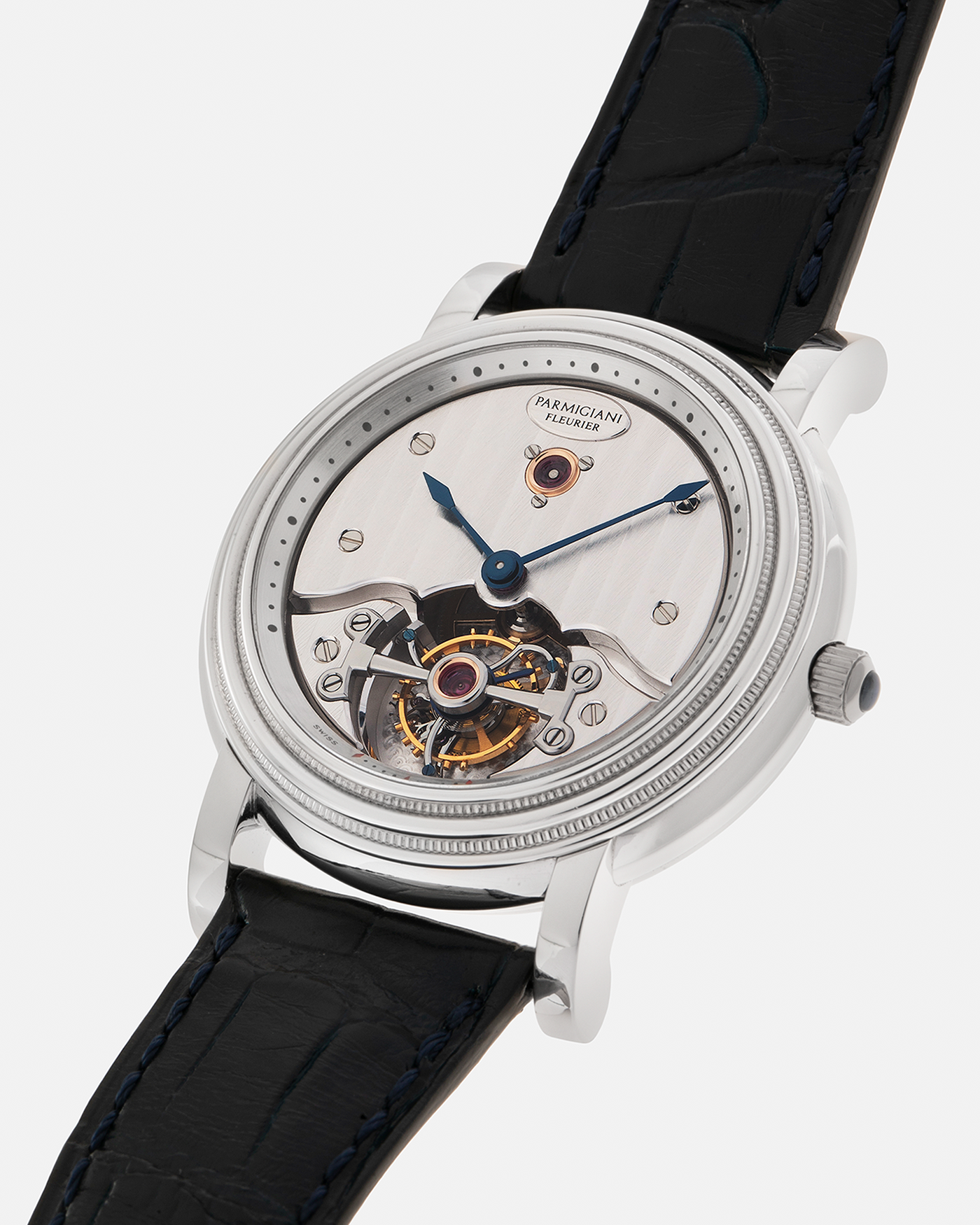 Brand: Parmigiani Fleurier
Year: 2001
Model: Toric Tourbillon
Reference: 2840
Material: Platinum 950
Movement: Parmigiani Fleurier Cal. PF280 (Based on Girard Perregaux Three Bridges 9900 ébauche, Manual-Winding
Case Dimensions: 40mm x 11mm (Lug-to-Lug 48mm)
Lug Width: 20mm
Strap: Camille Fornet Cousu Main Dark Navy Alligator Leather Strap with Signed Platinum 950 Deployant Clasp