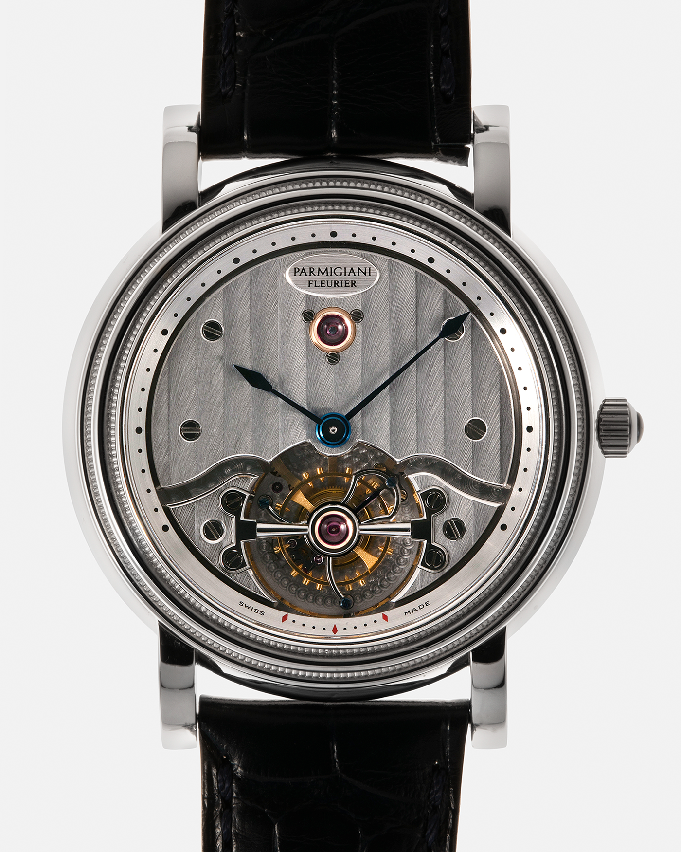 Brand: Parmigiani Fleurier
Year: 2001
Model: Toric Tourbillon
Reference: 2840
Material: Platinum 950
Movement: Parmigiani Fleurier Cal. PF280 (Based on Girard Perregaux Three Bridges 9900 ébauche, Manual-Winding
Case Dimensions: 40mm x 11mm (Lug-to-Lug 48mm)
Lug Width: 20mm
Strap: Camille Fornet Cousu Main Dark Navy Alligator Leather Strap with Signed Platinum 950 Deployant Clasp