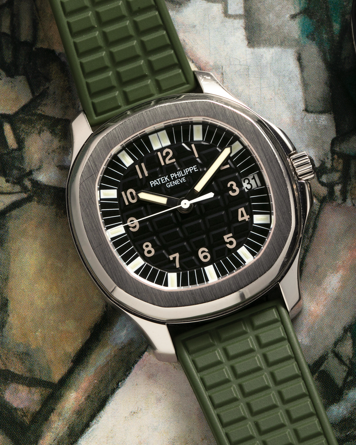 Brand: Patek Philippe
Year: 2000s
Model: Aquanaut
Reference Number: 5065A
Material: Stainless Steel
Movement: Patek Philippe Cal. 315 SC. Self-Winding
Case Dimensions: 38mm x 8.2mm (44mm Lug-to-Lug)
Strap: Patek Philippe Army Green Rubber Strap (Cut) with signed Stainless Steel Deployant Clasp, with additional Patek Philippe Beige Rubber Strap (Cut)