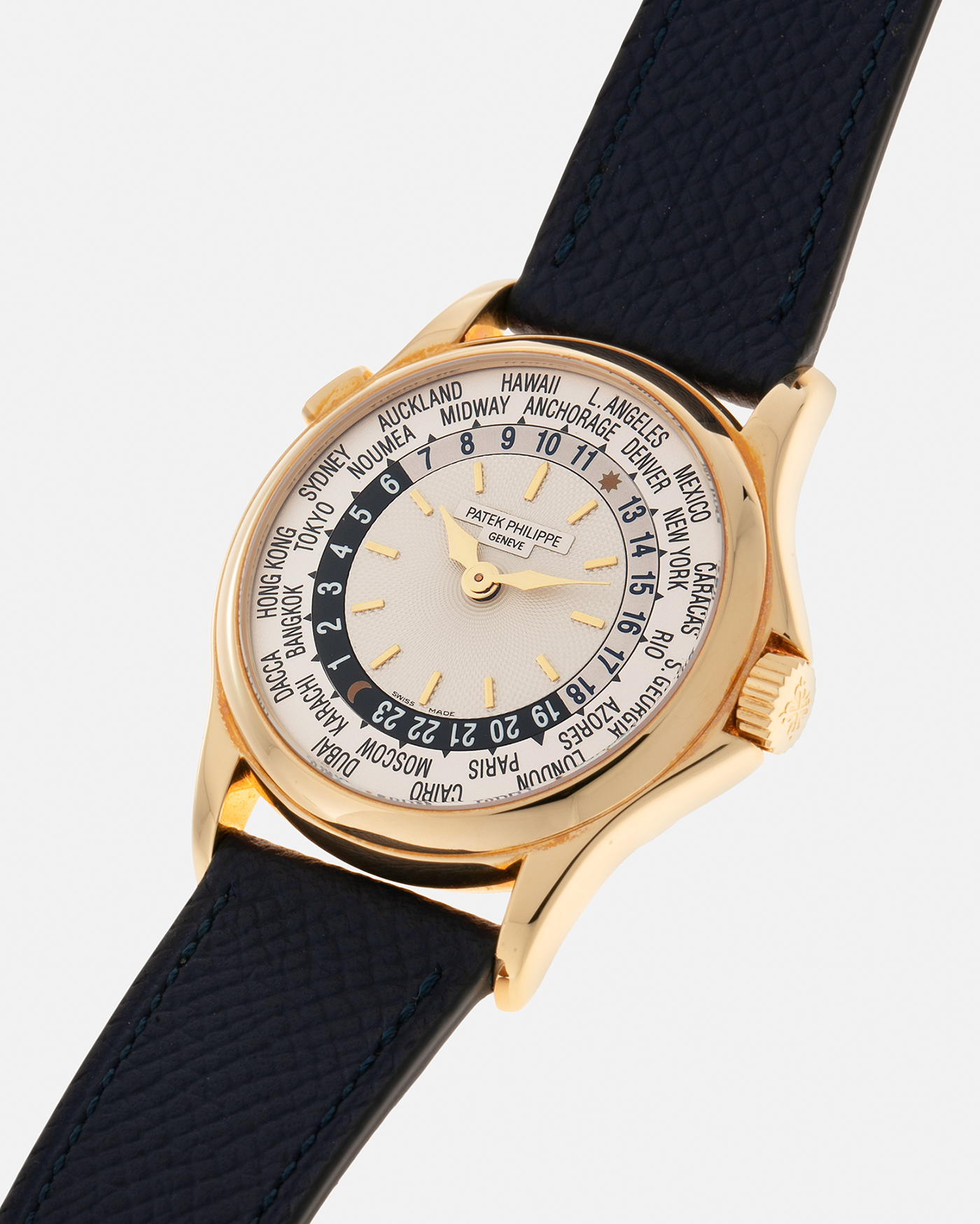 Brand: Patek Philippe Year: 2000s Model: World Time Reference Number: 5110J Material: 18-carat Yellow Gold Movement: Patek Philippe Cal. 240 HU Micro-Rotor, Self-Winding Case Diameter: 37mm Lug Width: 20mm Bracelet: Nostime Navy Blue Textured Calf Leather Strap with Signed 18-carat Yellow Gold Deployant Clasp, Patek Philippe Brown Alligator Leather Strap (Used)
